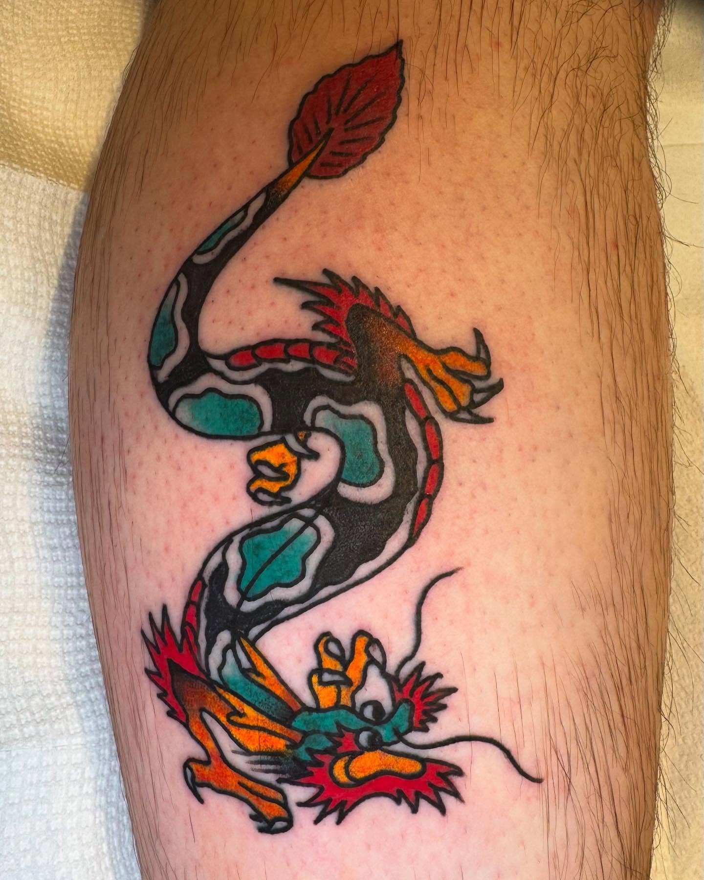 Dragon American traditional tattoo on the forearm by Rob Keiuf