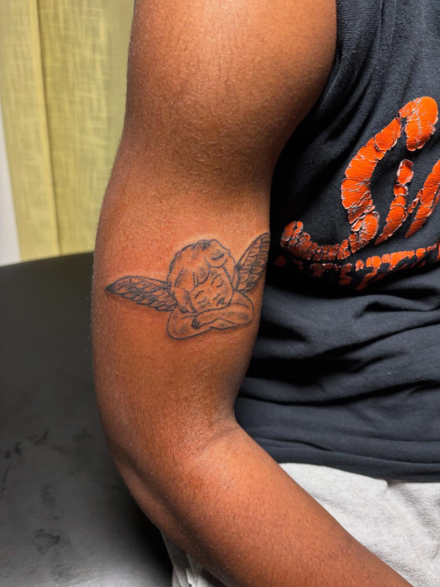 Angel black and grey tattoo on the forearm by Mc X Happo