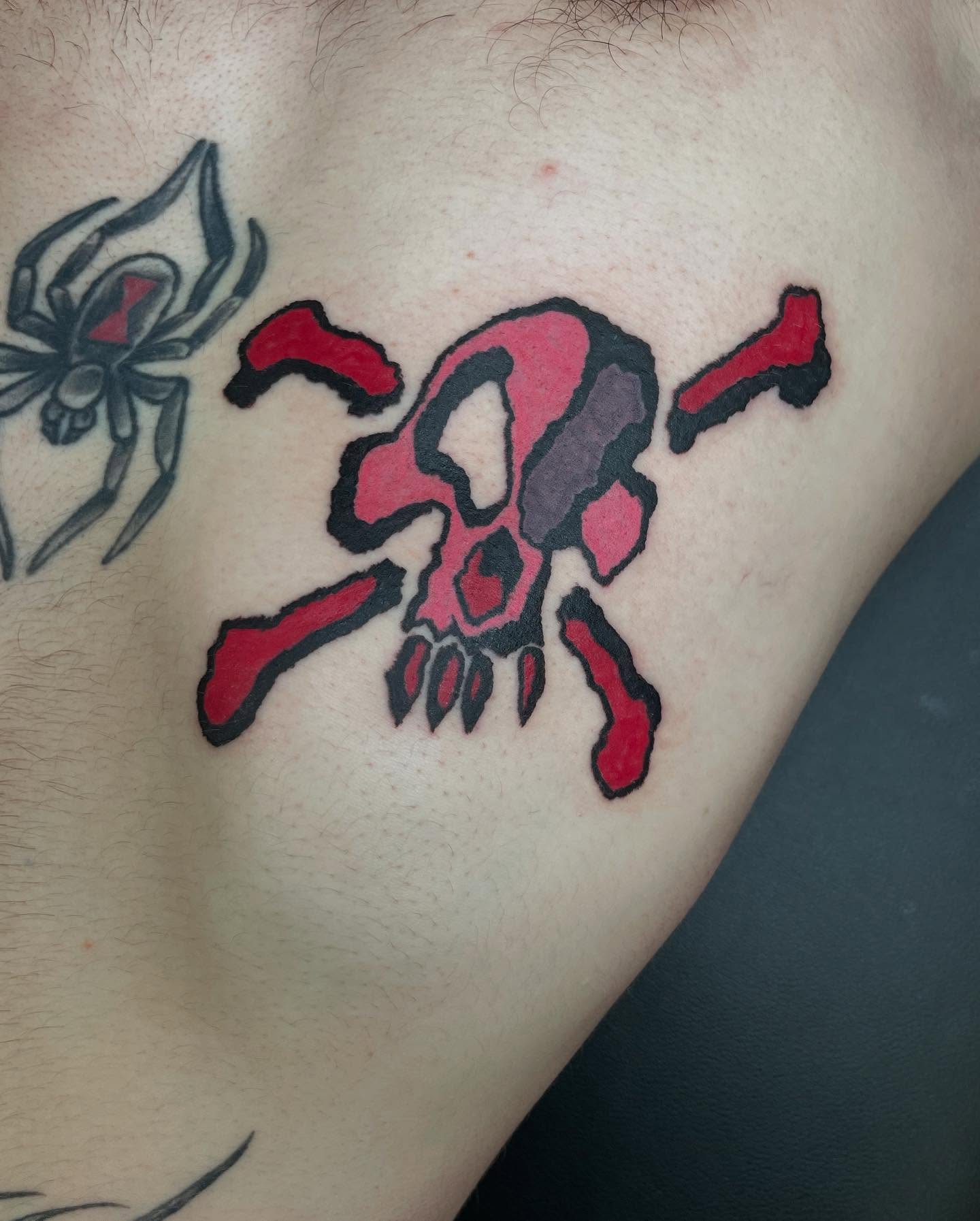 Skull and crossbones geometric tattoo on the chest by @emotionalthugtattoo