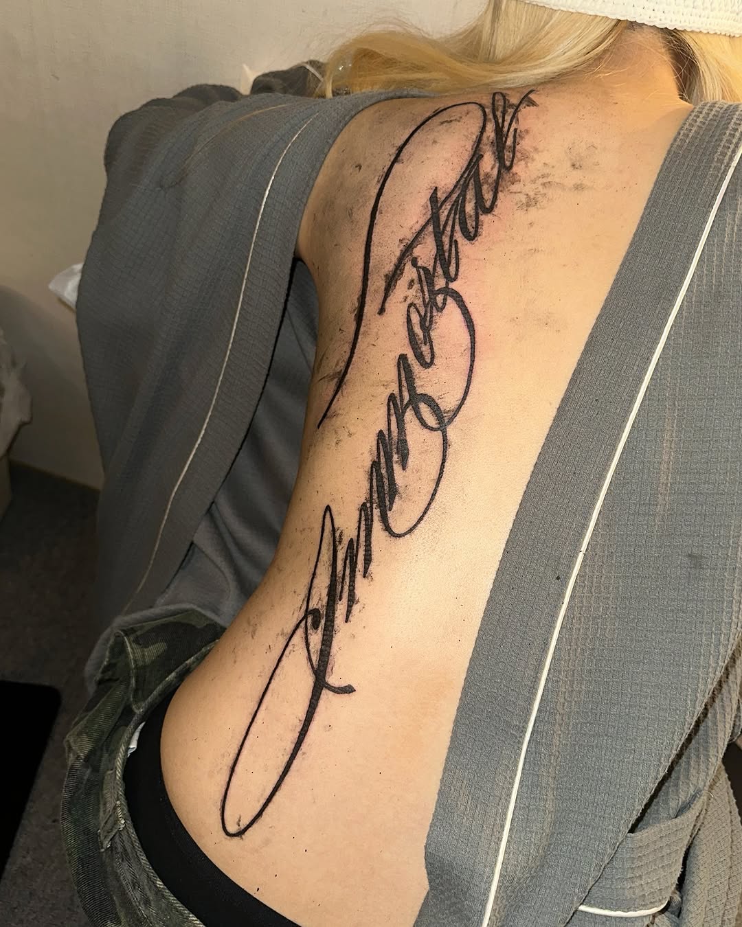 Script lettering lettering tattoo on the shoulder by eyeball