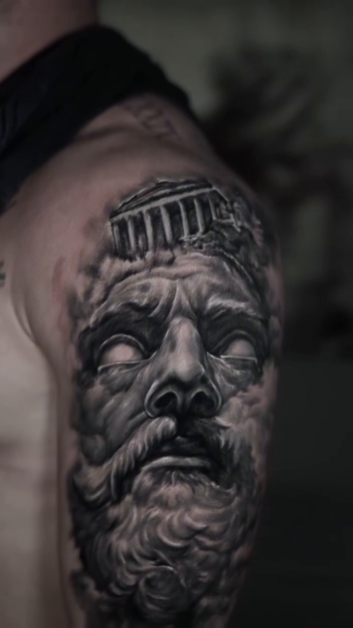 Greek god's head realism tattoo by Gregorio Devera
