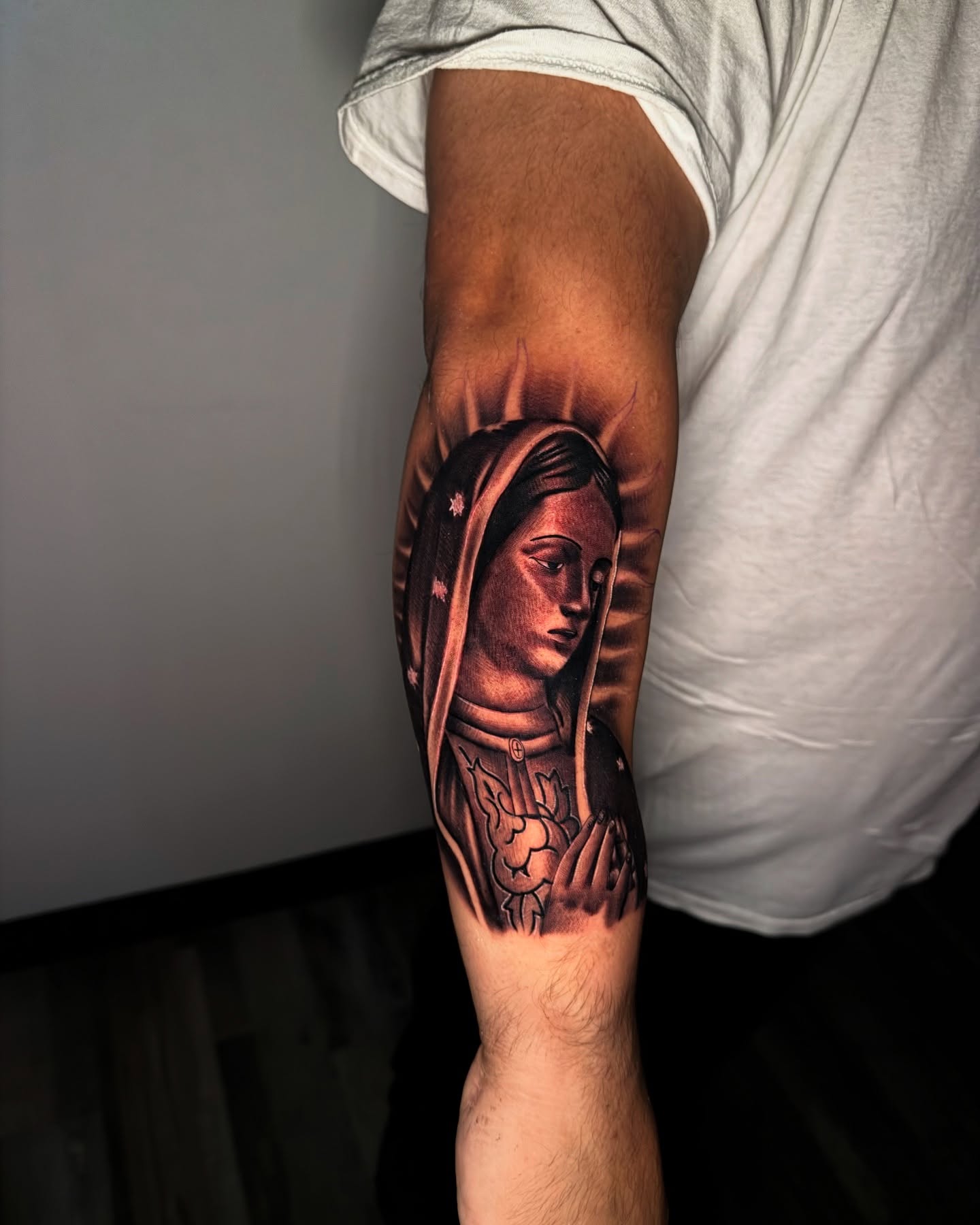 Religious figure realism tattoo on the forearm by Aaron Saenz jr