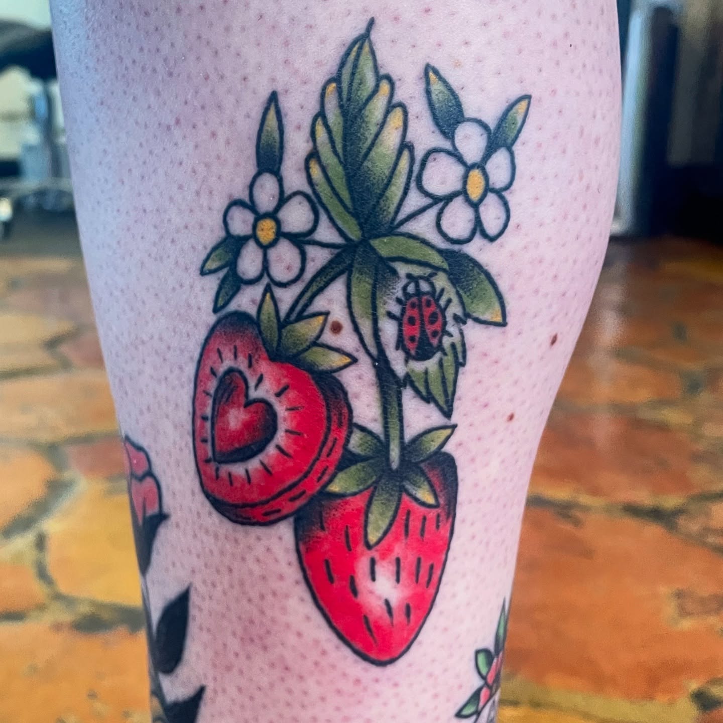 Strawberries and flowers American traditional tattoo on the forearm by Cam TallBoy SLC Tattoo Artist, Salt Lake City, Utah
