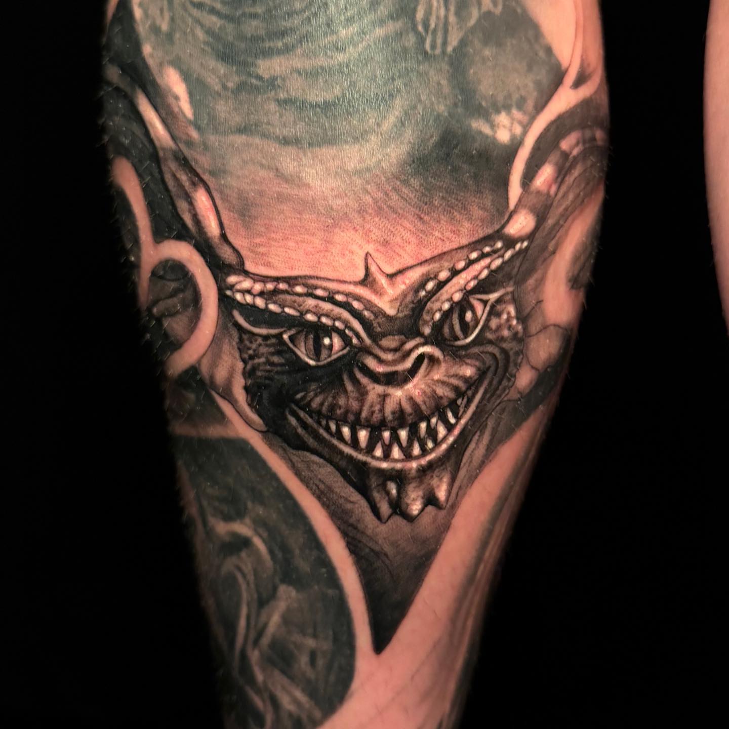 Demon face dark realism tattoo on the forearm by Tad Fulkerson, San Francisco, California