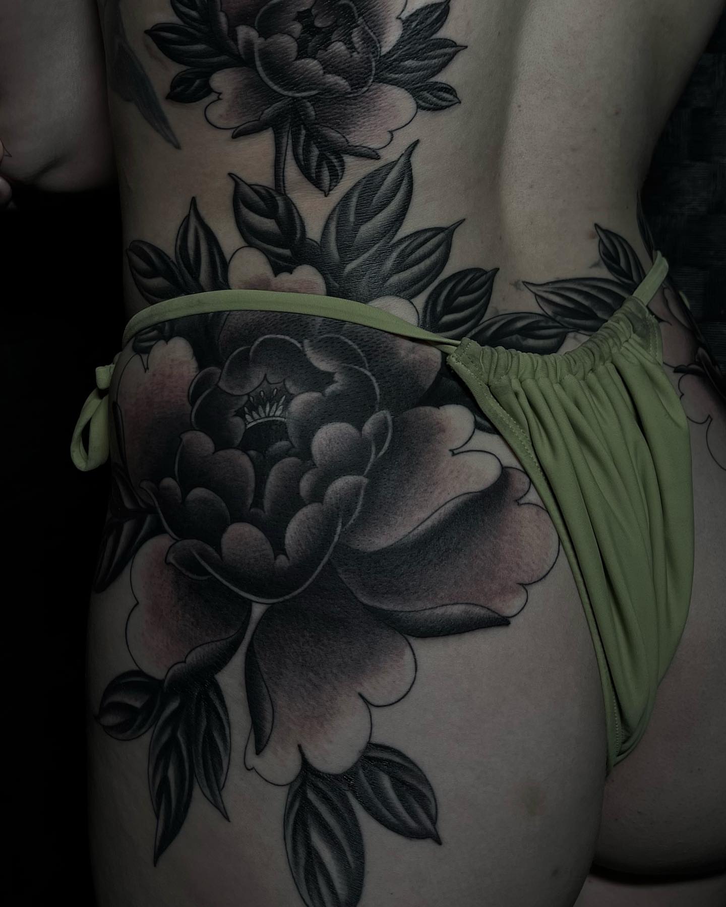 Peony black and grey tattoo on the thigh by Kayla Faircloth, Charlotte, North Carolina