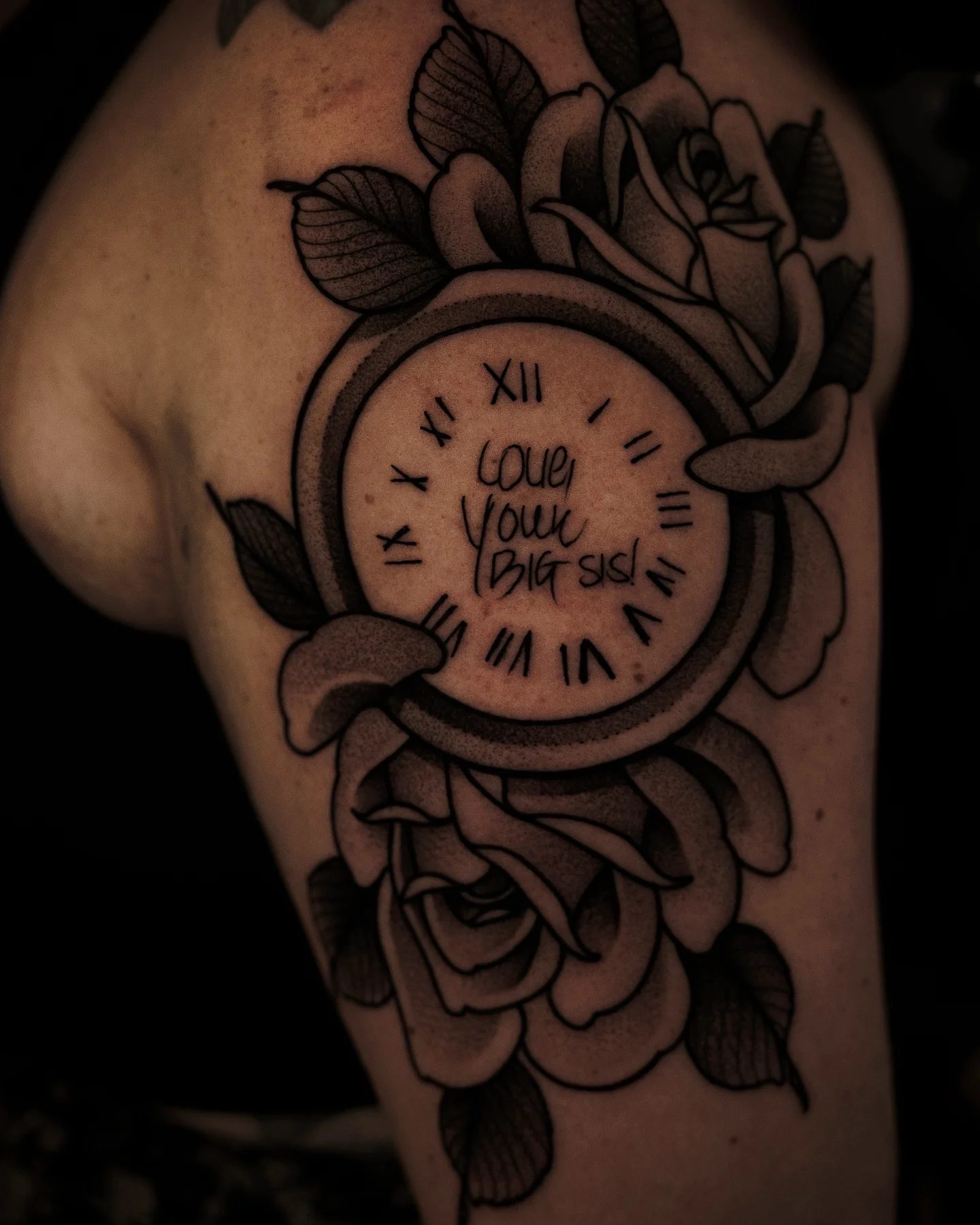 Clock with floral design black and grey tattoo on the forearm by Craig St Peter, Kansas City, Missouri
