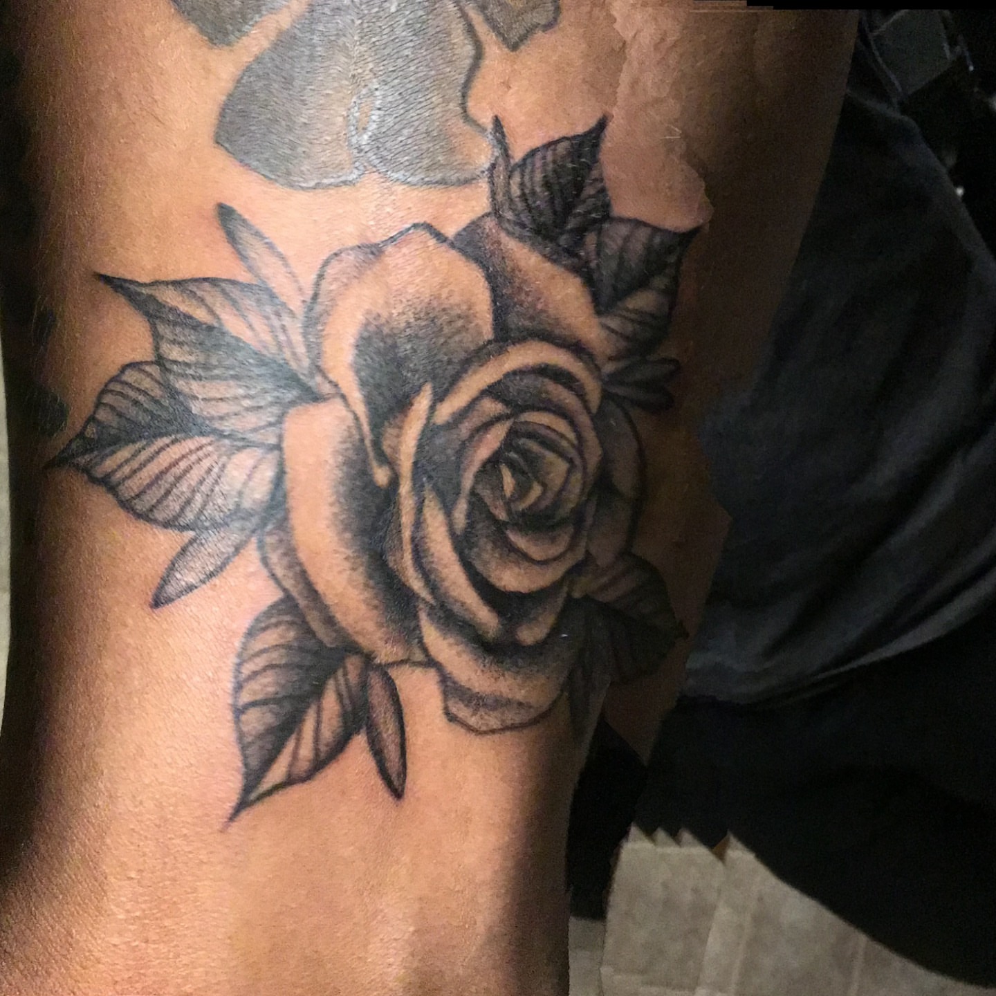 Rose black and grey tattoo on the forearm by Gabriel Lawton