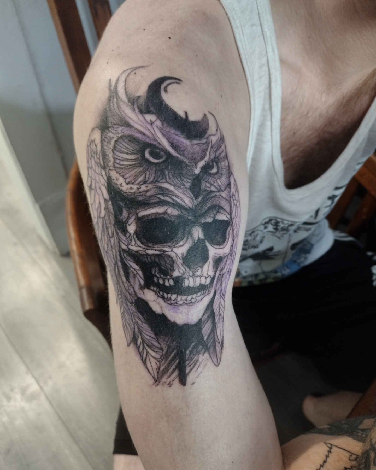 Skull with owl dark realism tattoo on the forearm by Gabriel Lawton