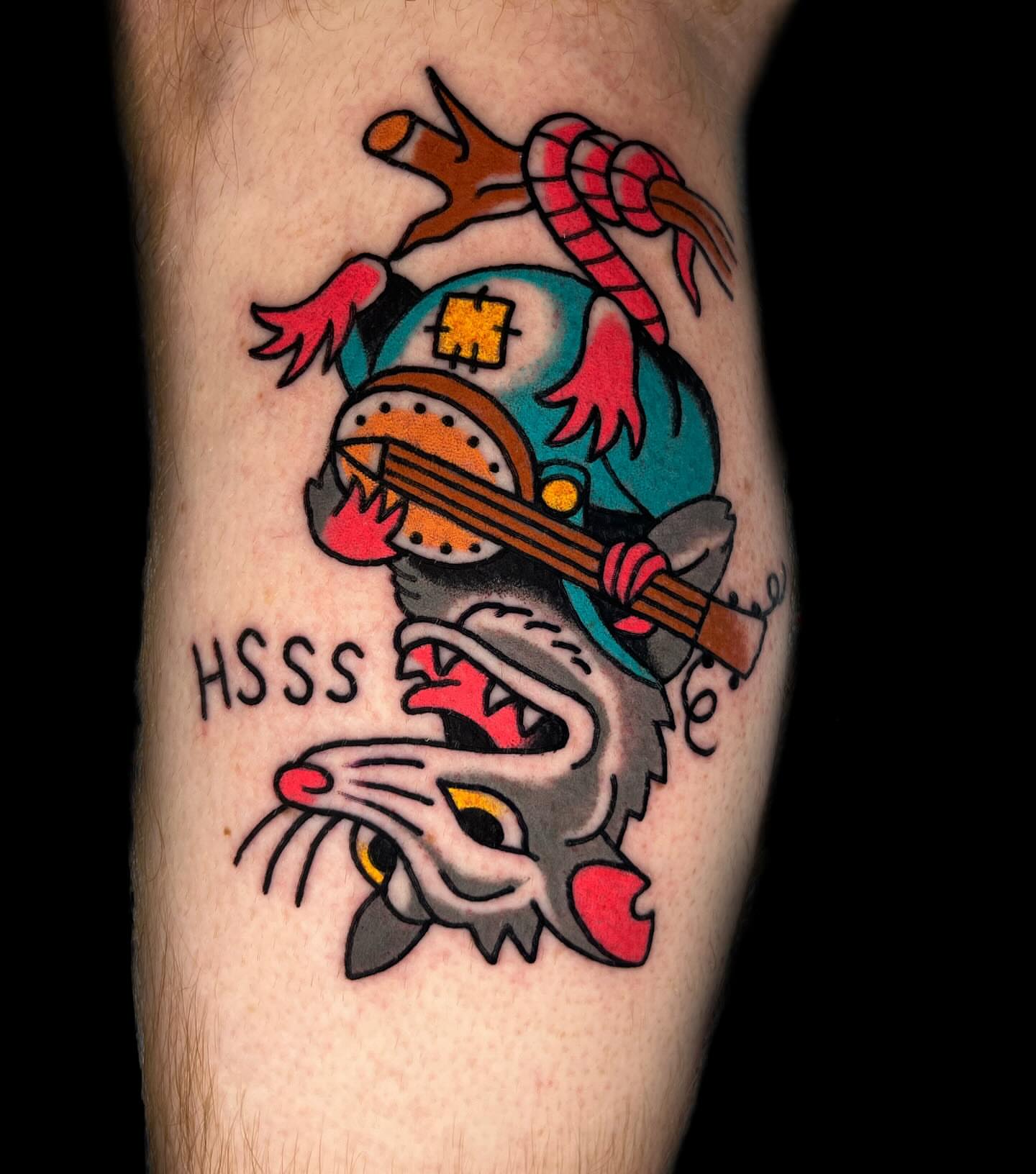 Snake and guitar American traditional tattoo on the forearm by Hayden Combs