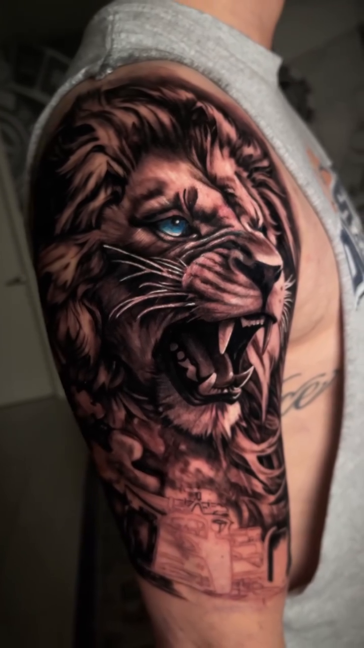 Lion head with cityscape realism tattoo by Claude Steven Estrada, Las Vegas, Nevada