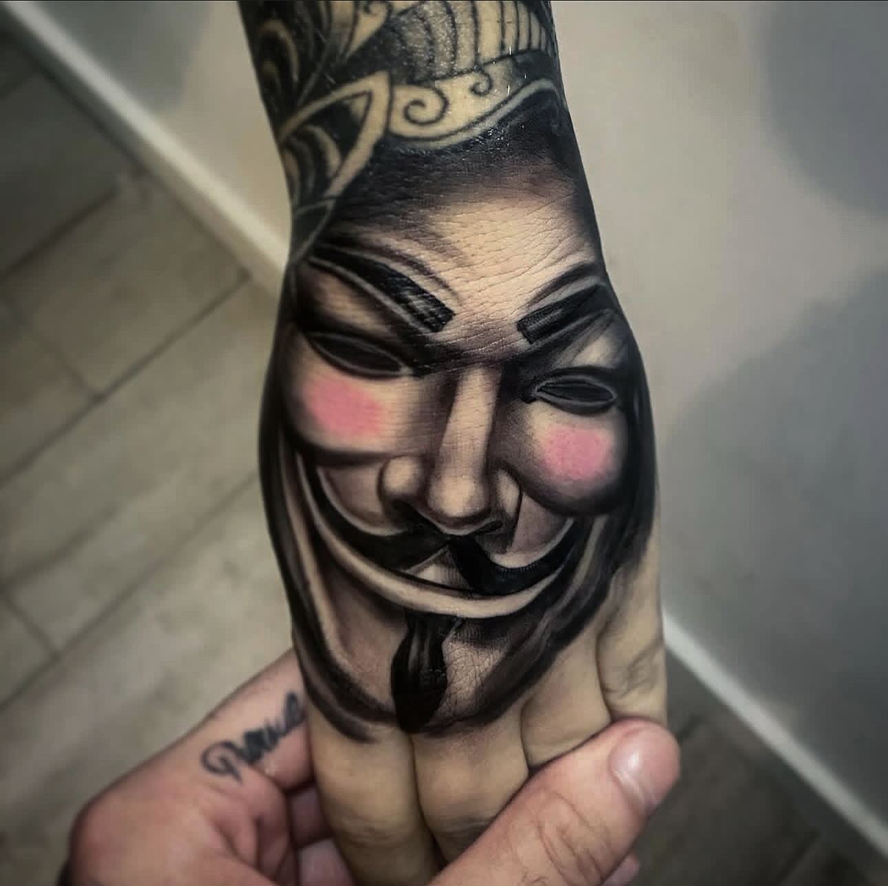 V for vendetta mask realism tattoo on the forearm by Tattoos in Fort Myers, Fl
