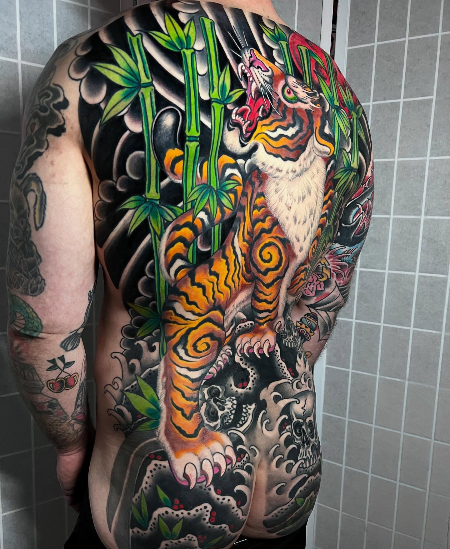 Tiger and bamboo japanese irezumi tattoo on the back by Barron