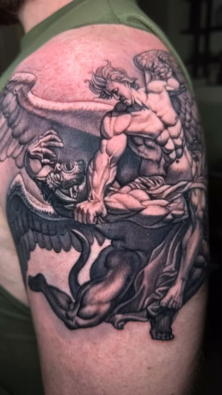Angel fighting demon realism tattoo by Abel Deida