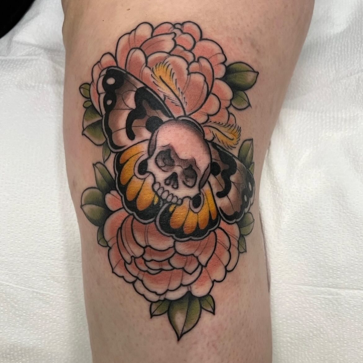 Skull and flowers American traditional tattoo on the forearm by Kyle Olson, Salt Lake City, Utah
