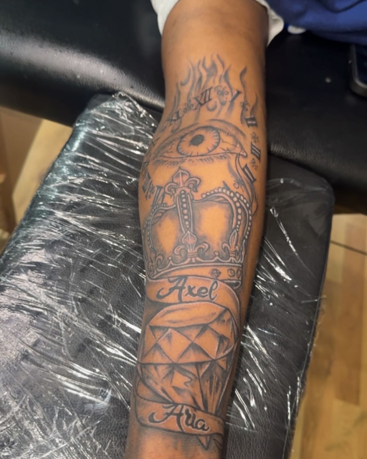 Eye and crown black and grey tattoo on the forearm by Jihaad staley π¦, Charlotte, North Carolina