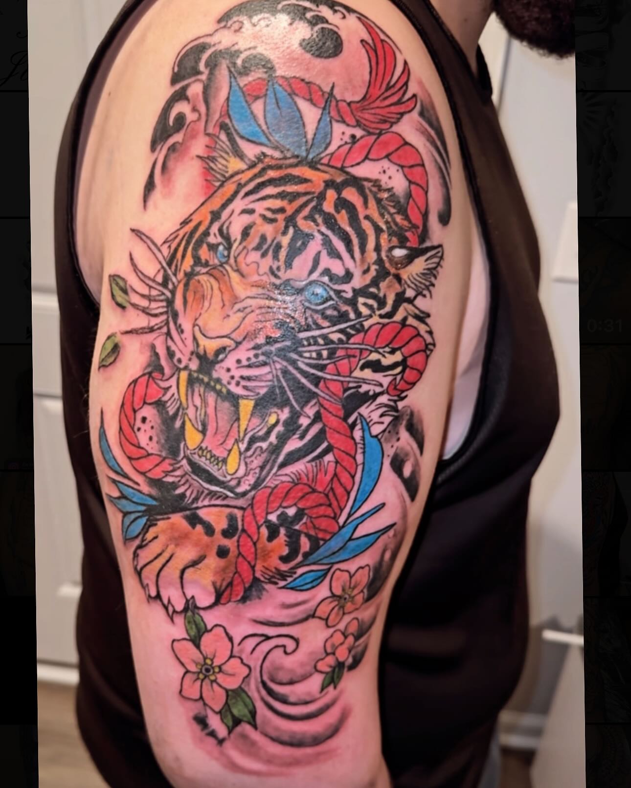 Tiger and cherry blossoms japanese irezumi tattoo on the shoulder by Jihaad staley π¦, Charlotte, North Carolina