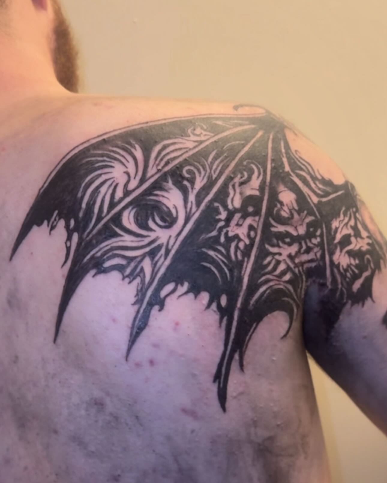 Bat wings black and grey tattoo on the shoulder by Jihaad staley π¦, Charlotte, North Carolina