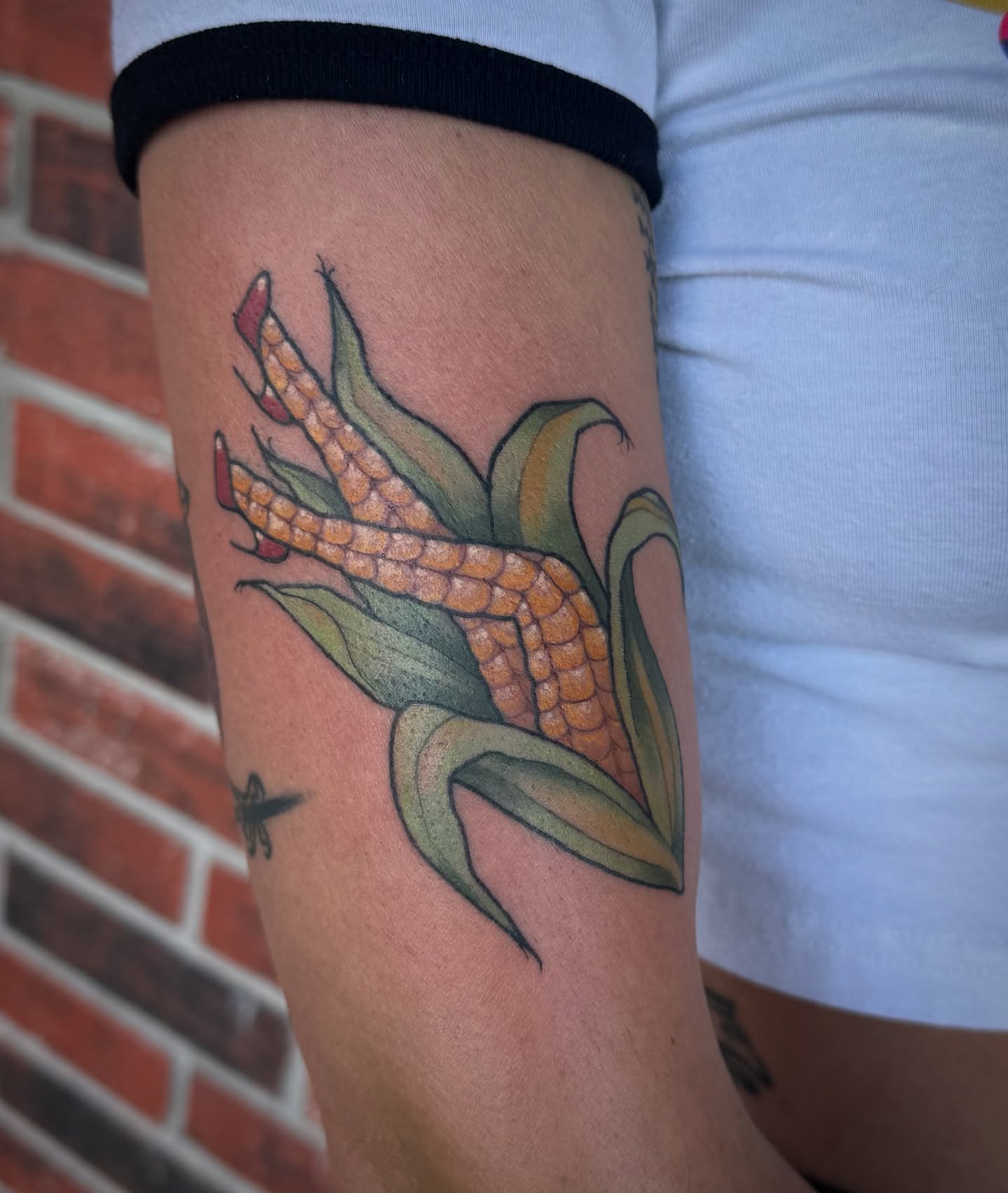 Corn ear realism tattoo on the forearm by Bella Wingo