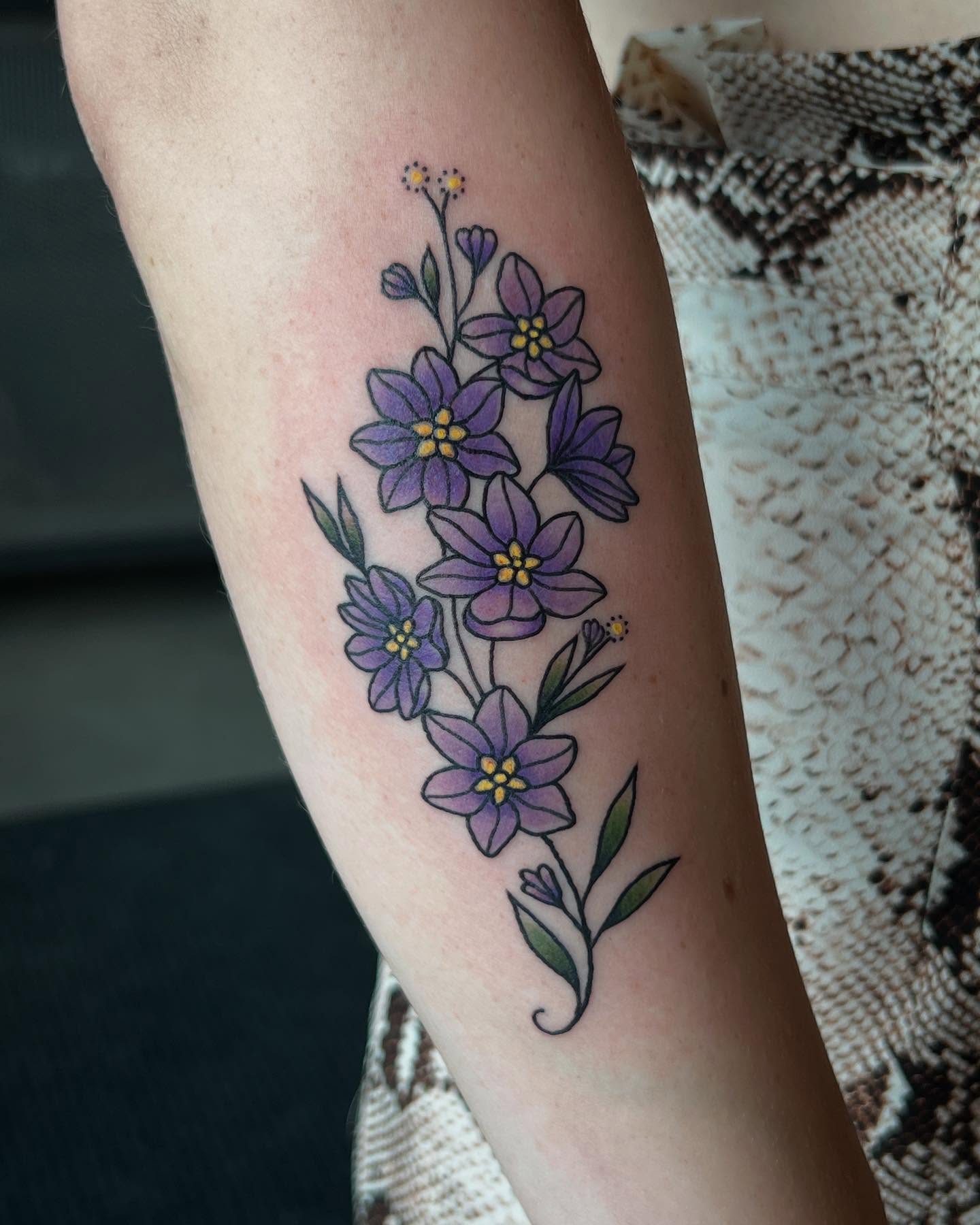 Purple flowers dotwork tattoo on the forearm by Siërra Nicole, Minneapolis, Minnesota
