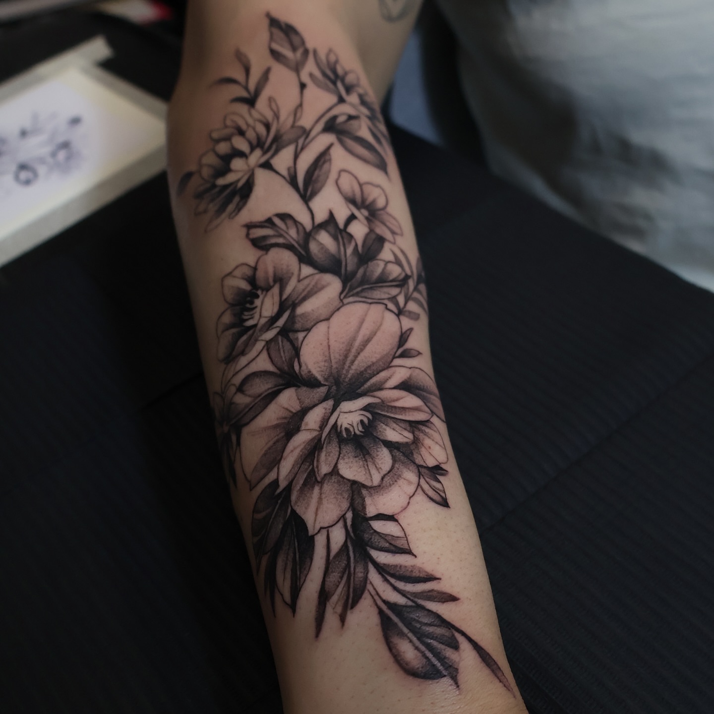 Floral arrangement dotwork tattoo on the forearm by mssinderella