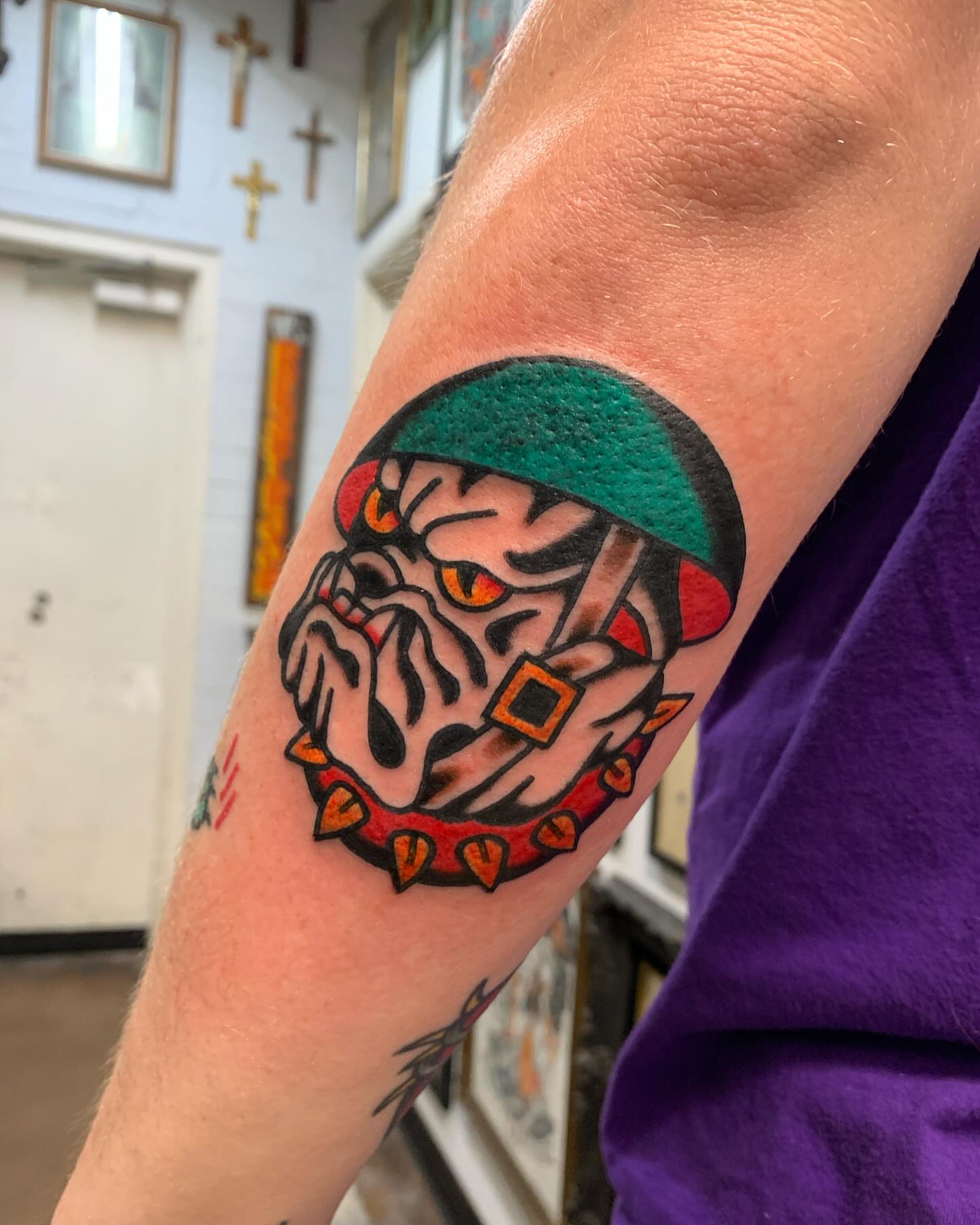 Mask with eyes American traditional tattoo on the forearm by Chrissie