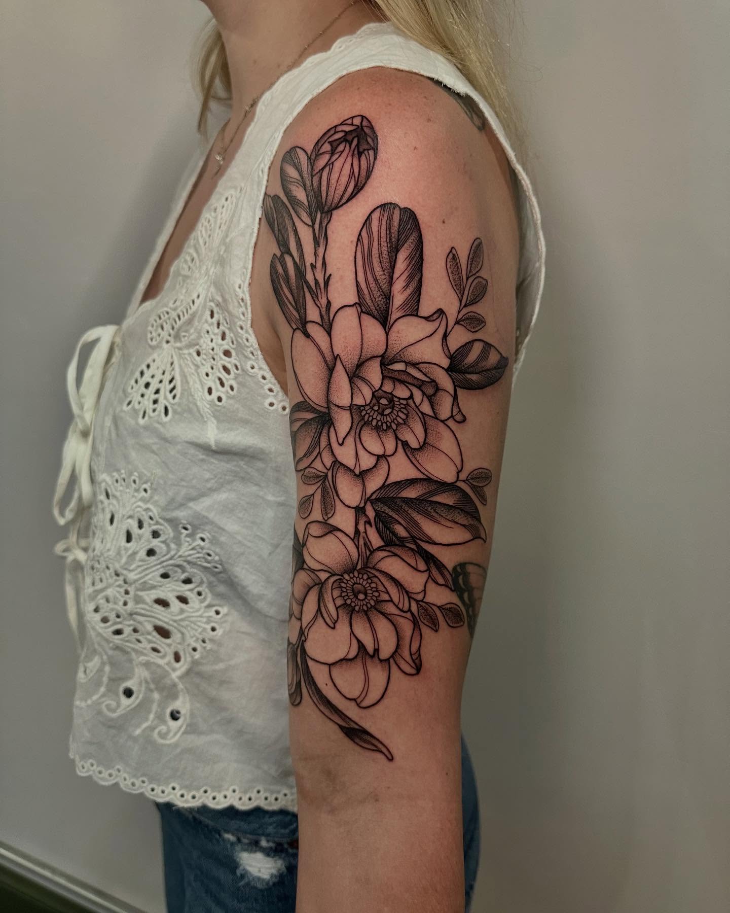 Floral arrangement black and grey tattoo on the upper arm by Abby ✣ fineline and blackwork ✣