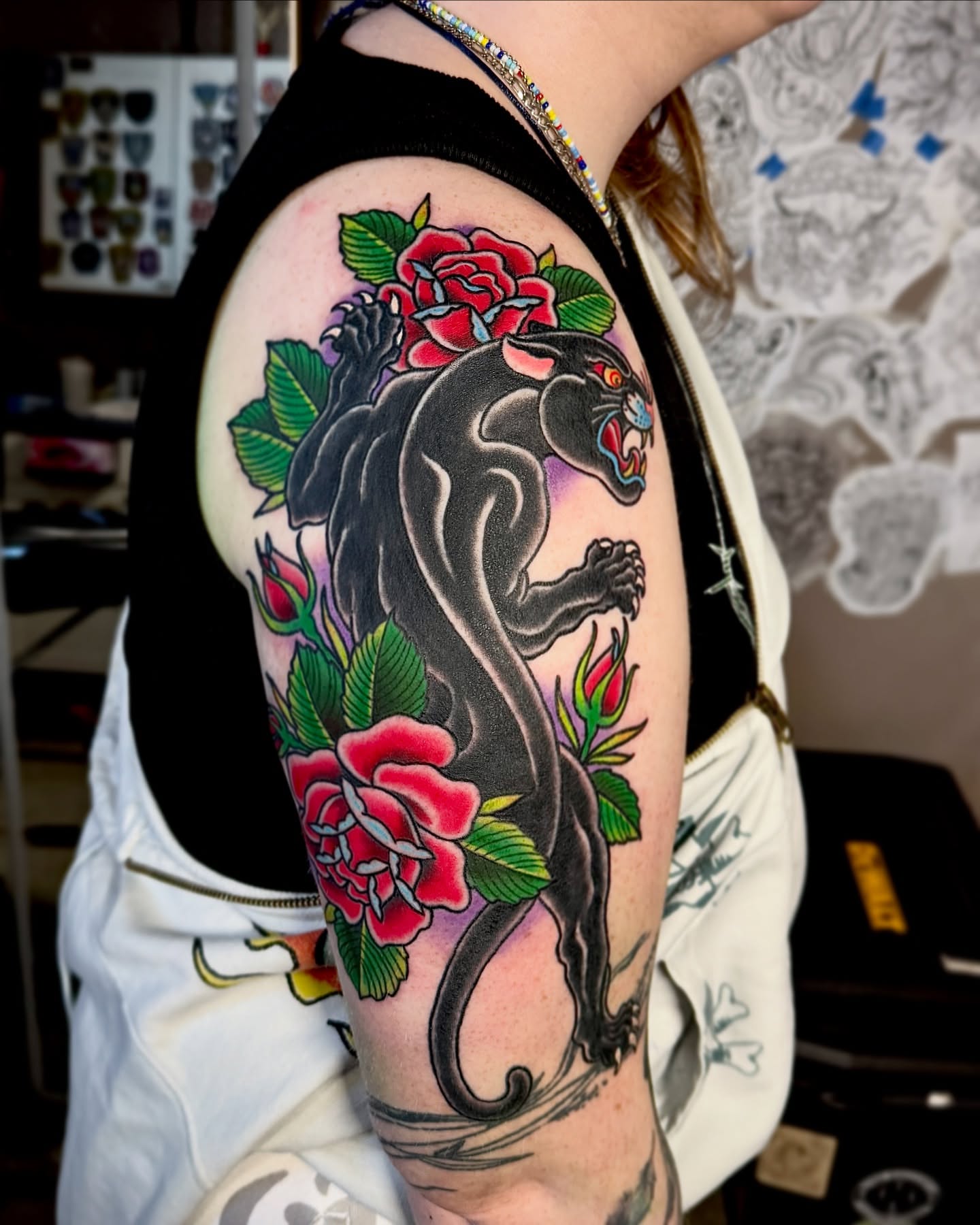 Panther and roses American traditional tattoo on the forearm by Derek Cilla, Bethlehem, Pennsylvania
