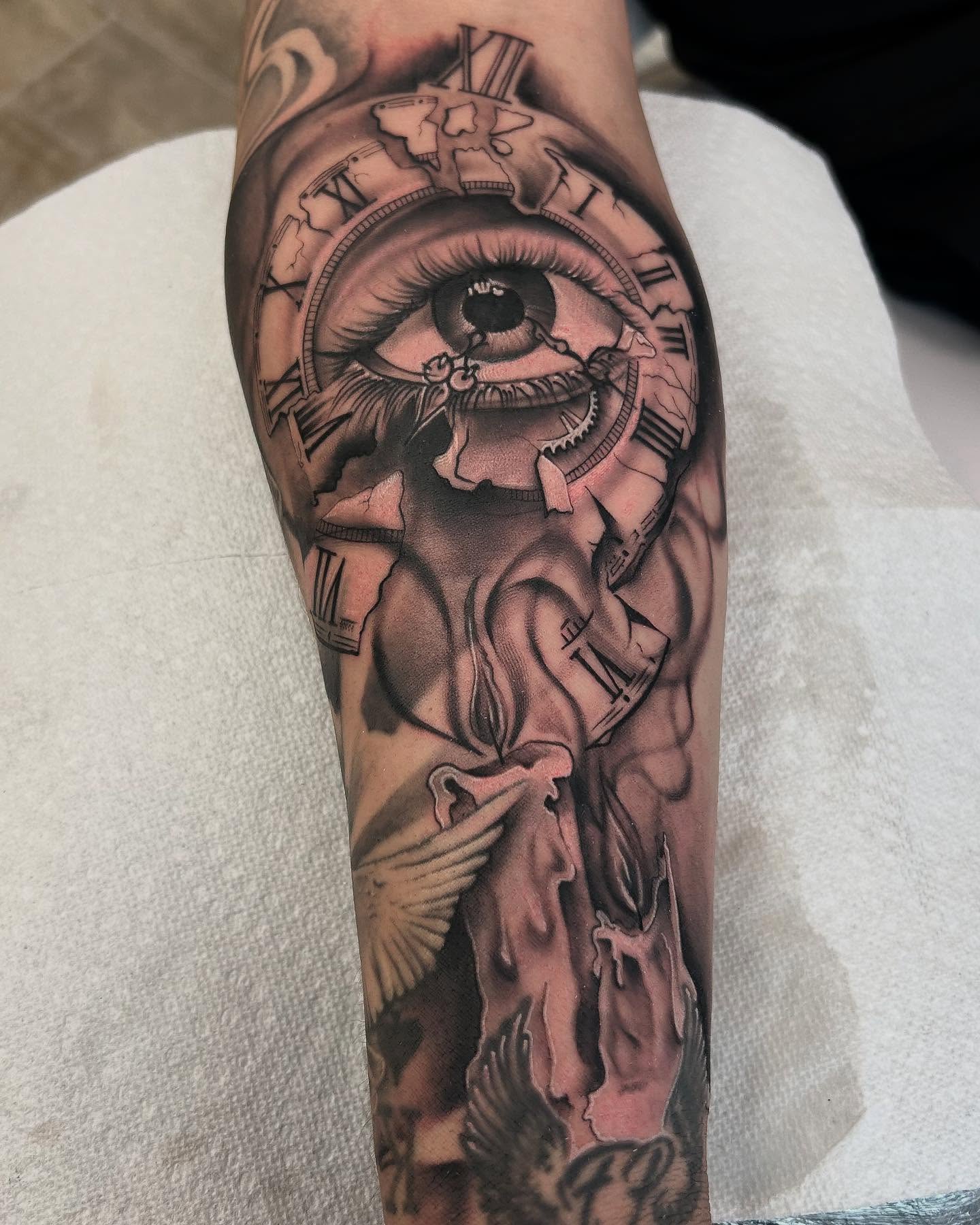 Eye and clock realism tattoo on the forearm by Denis Morello de Castro, South River, New Jersey