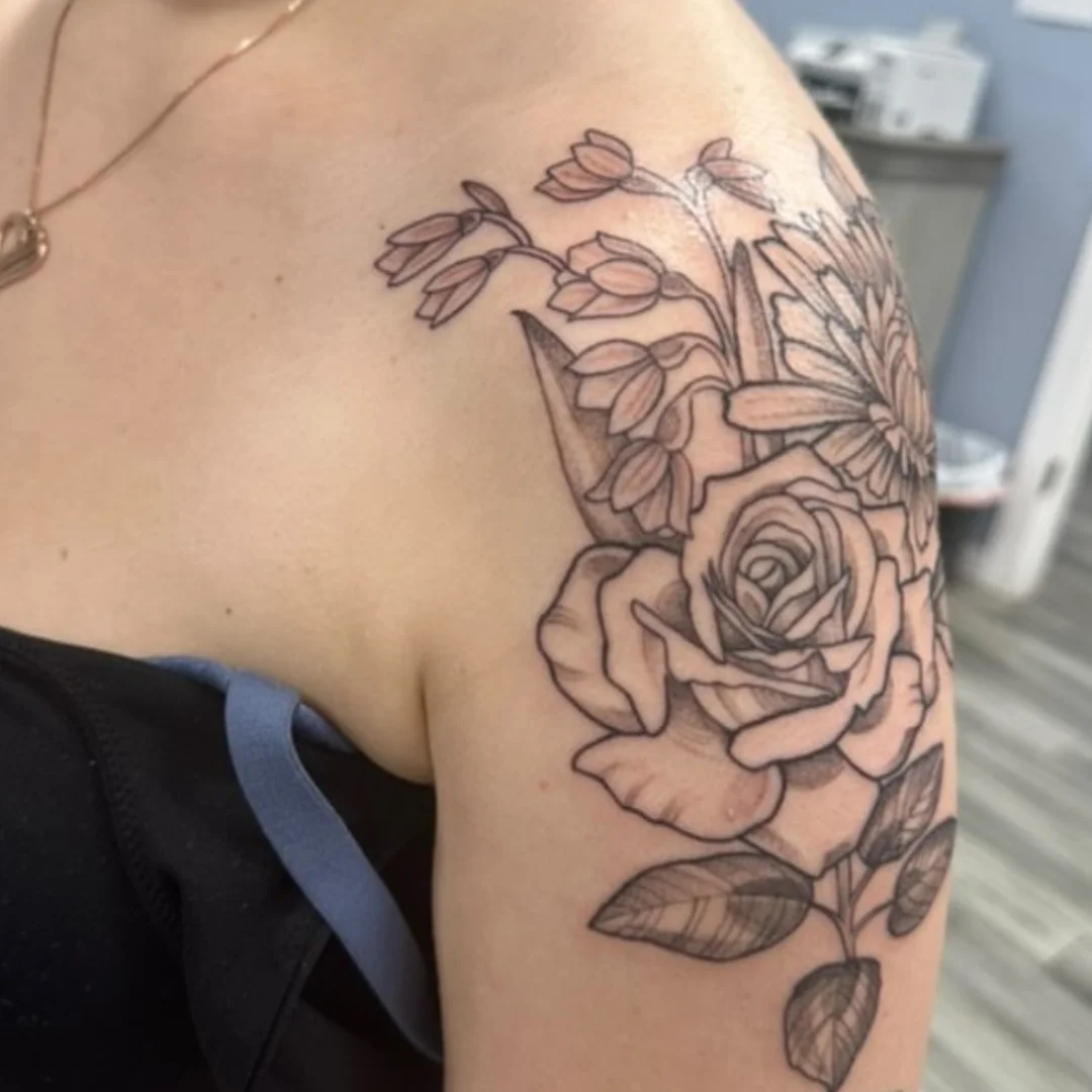 Flower bouquet realism tattoo on the shoulder by jackie