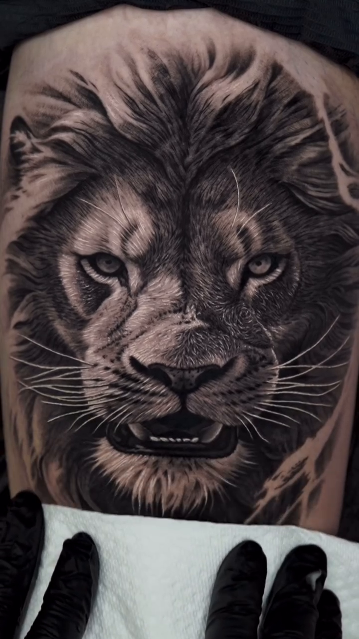 Lion portrait realism tattoo by Jesus Alonso