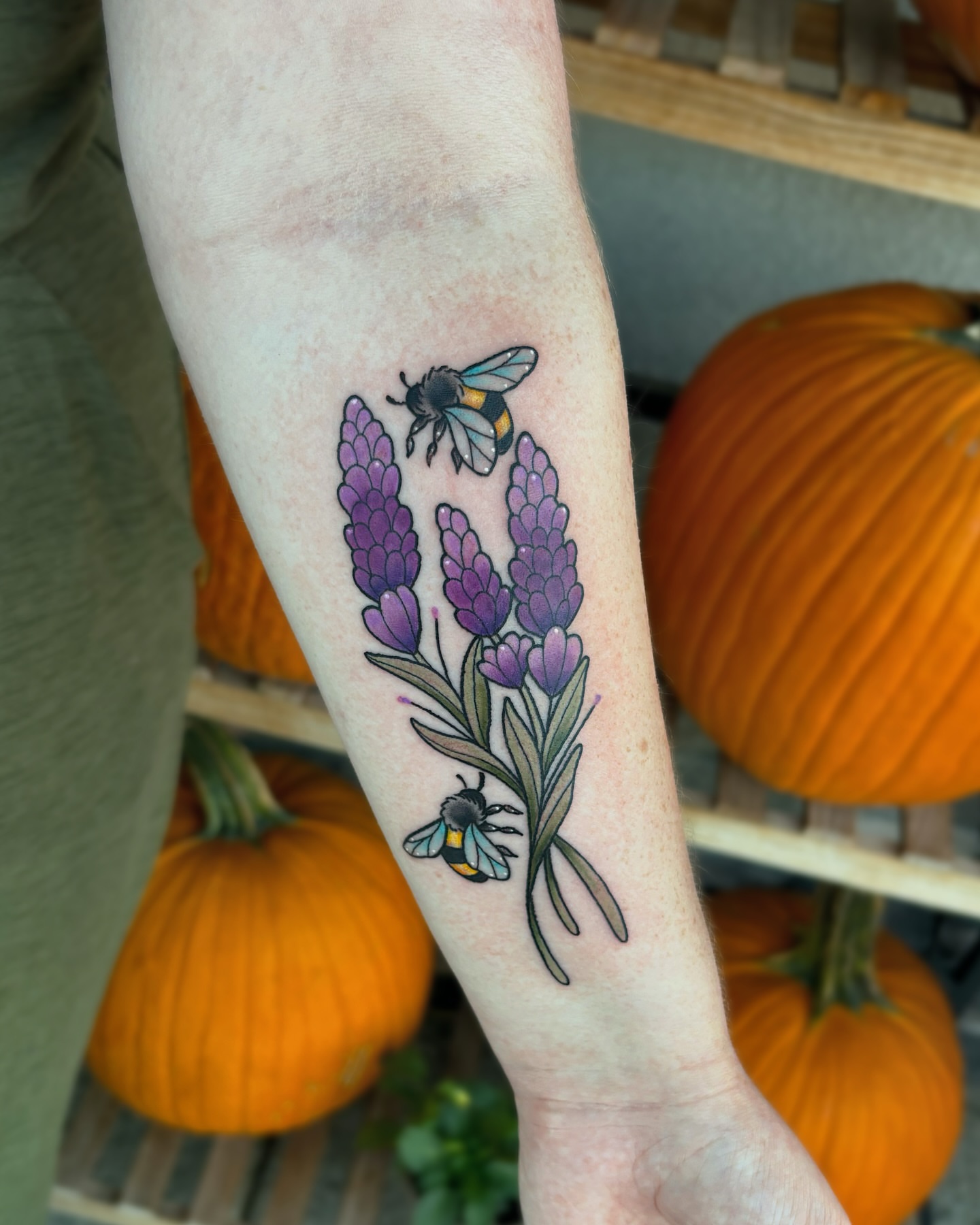 Lavender and bee realism tattoo on the forearm by Bunny Noel