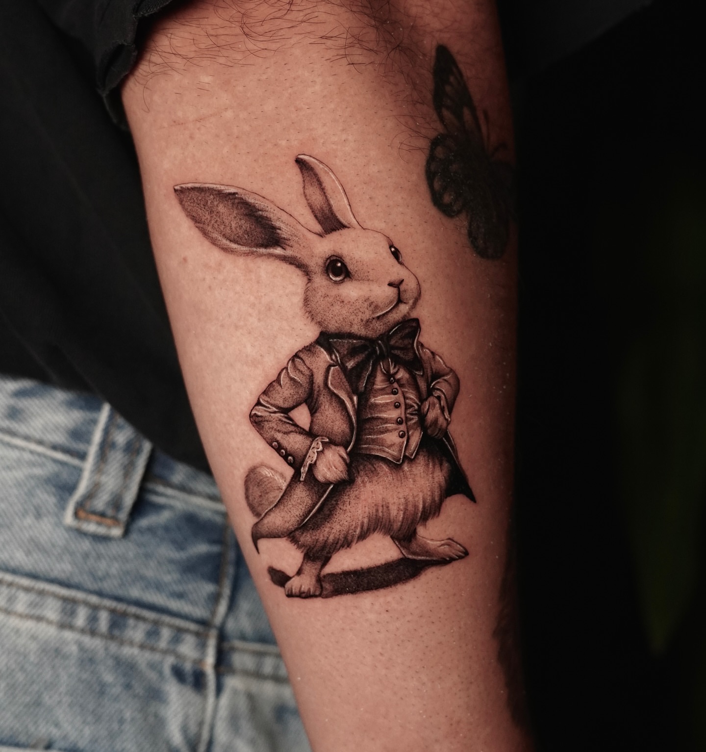 Rabbit in suit realism tattoo on the forearm by Sophia Delfino