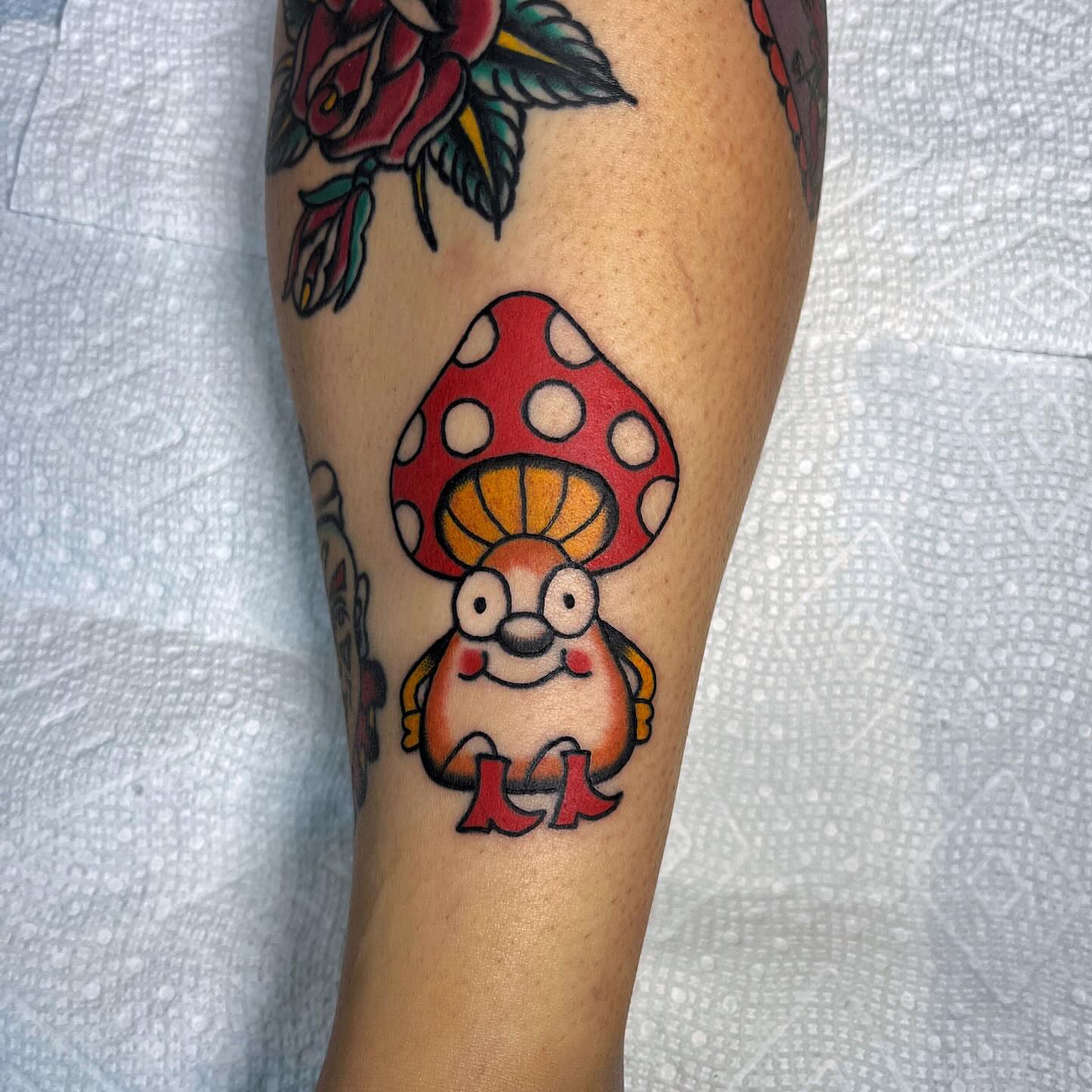 Mushroom character trash polka tattoo on the forearm by Elizabeth Summers ❨・¨⬮ Traditional Tattoo