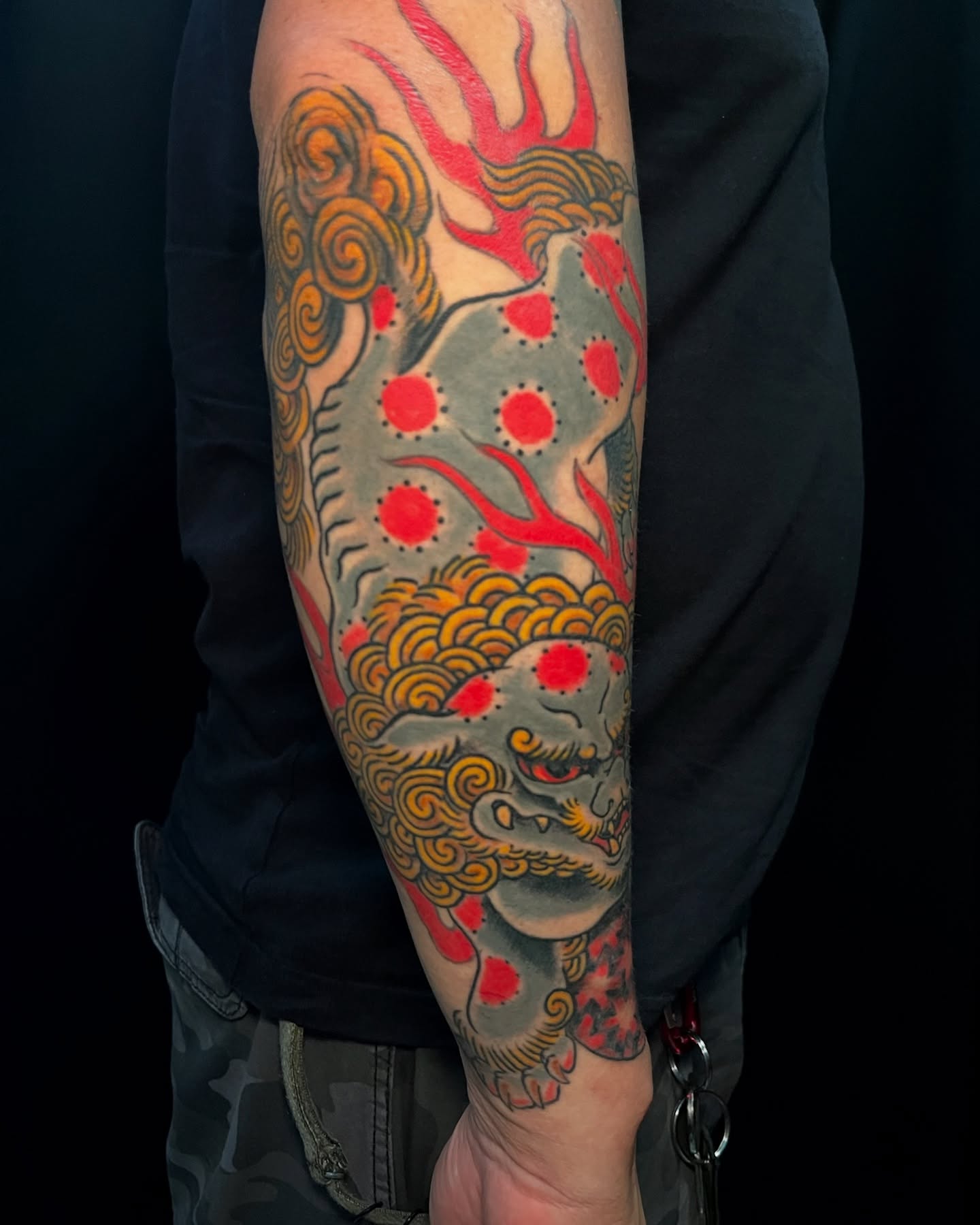 Lion American traditional tattoo on the forearm by Andrew Snowden