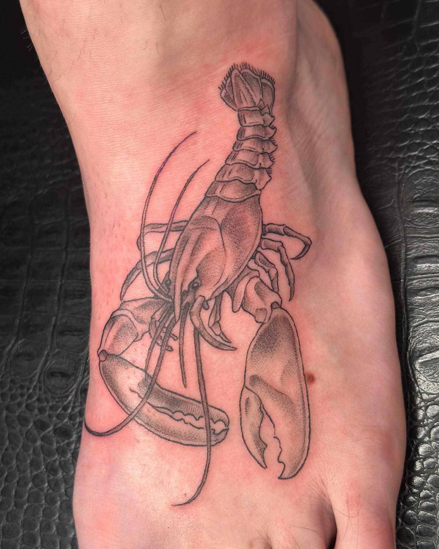 Lobster black and grey tattoo on the foot by Hi