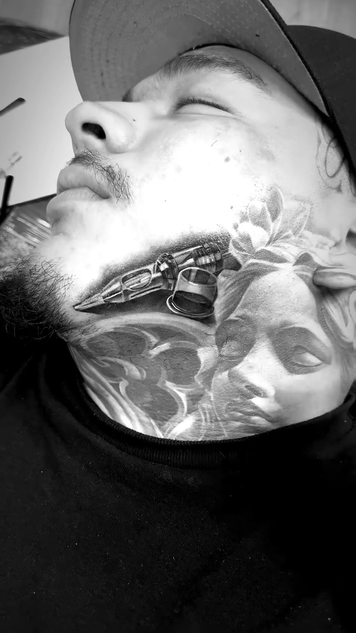 Woman's face and flowers realism tattoo by Antonio Pavić, Los Angeles, California