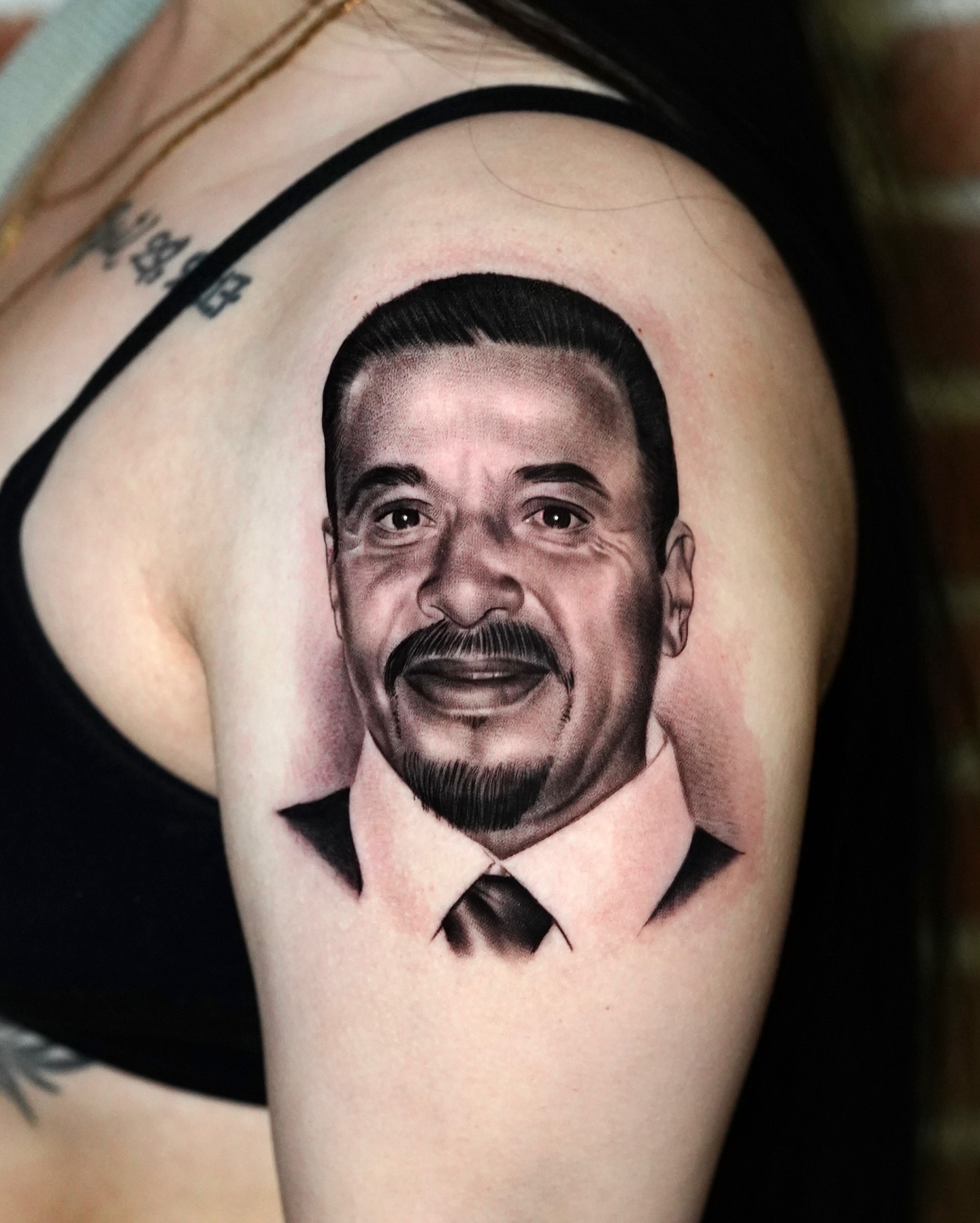 Portrait realism tattoo on the shoulder by Luis Peña