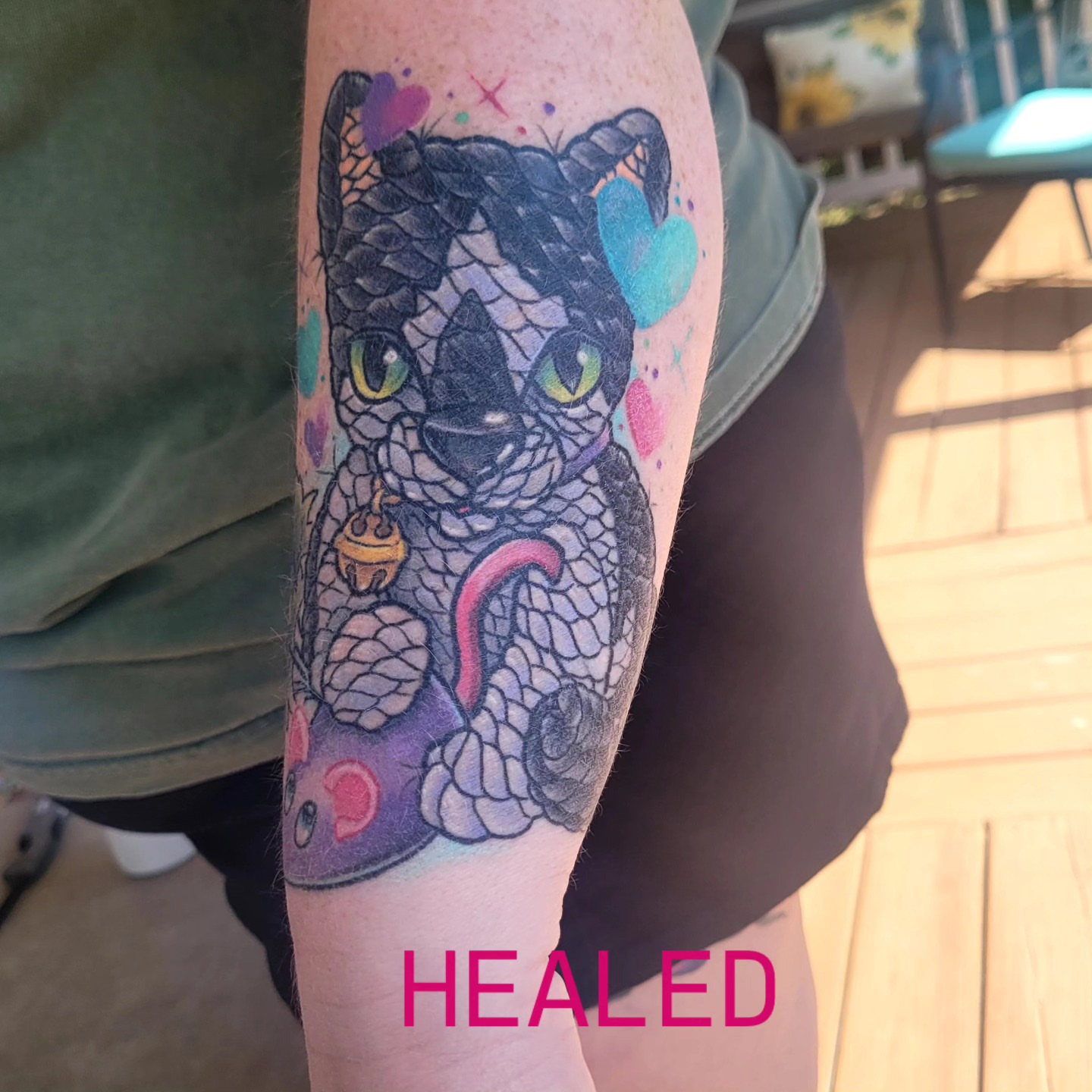 Cat watercolor tattoo on the forearm by Dawne Michele