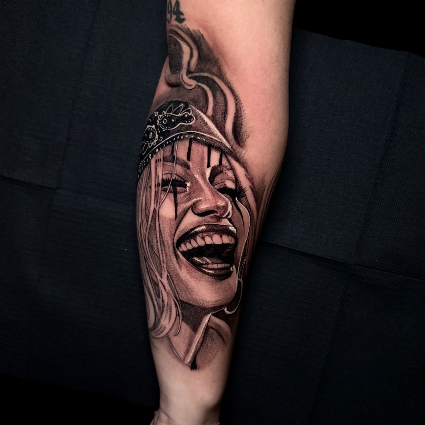 Woman crying realism tattoo on the forearm by Tattoo Artist
