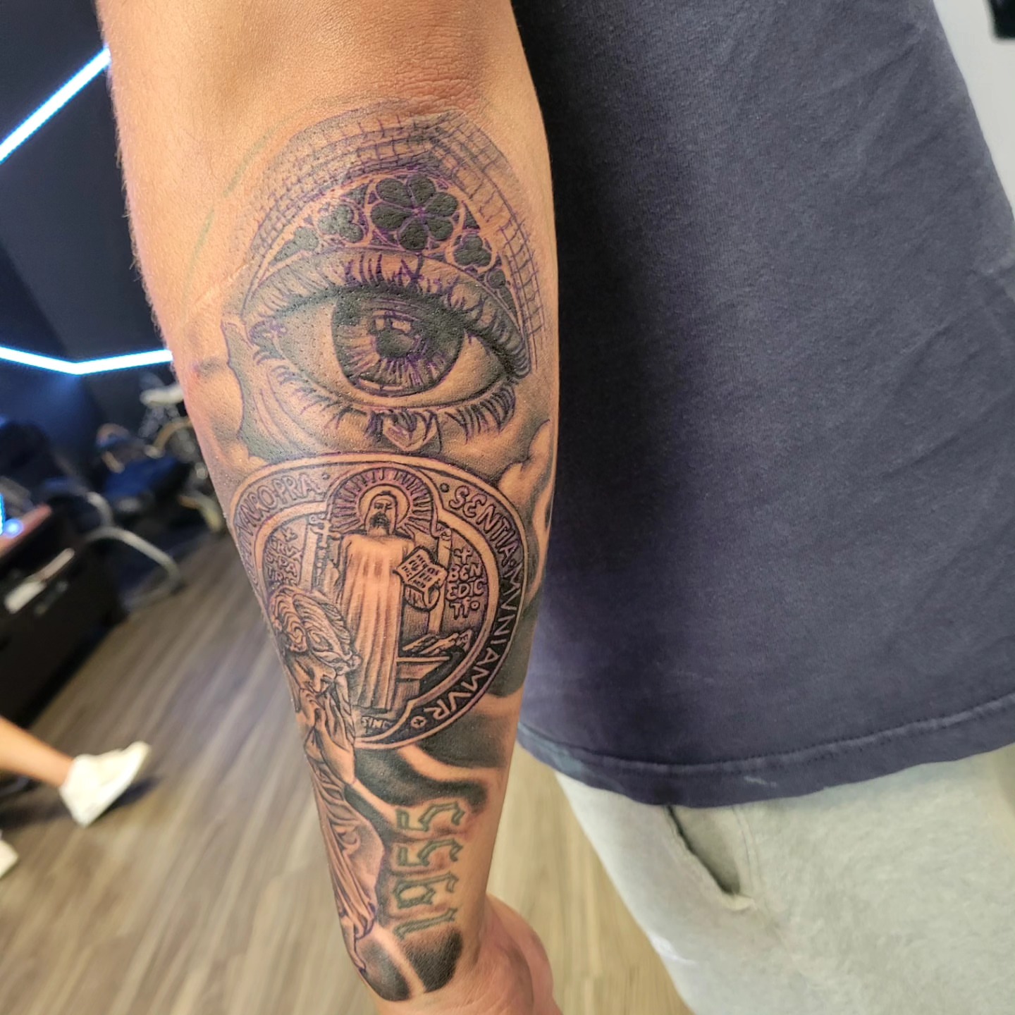 Eye and religious icon realism tattoo on the forearm by Beto Tats, Round Rock, Texas