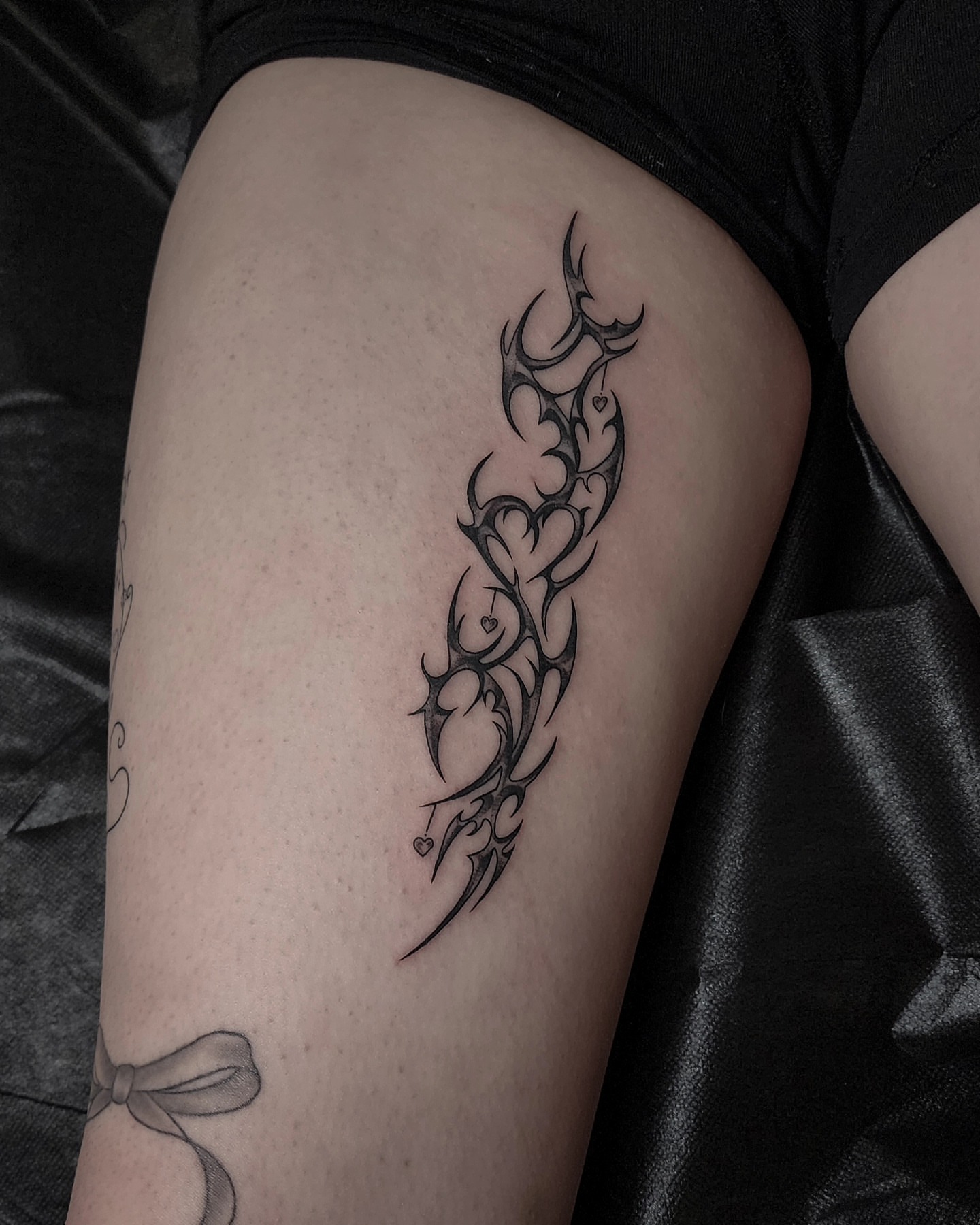 Tribal design tribal tattoo on the thigh by Mariah Giovanna Hodgens