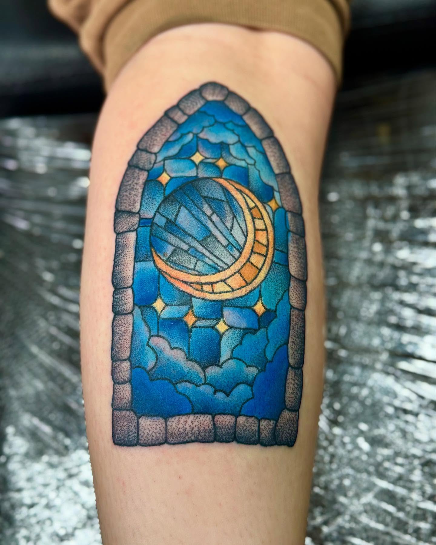 Stained glass window geometric tattoo on the thigh by William Worley