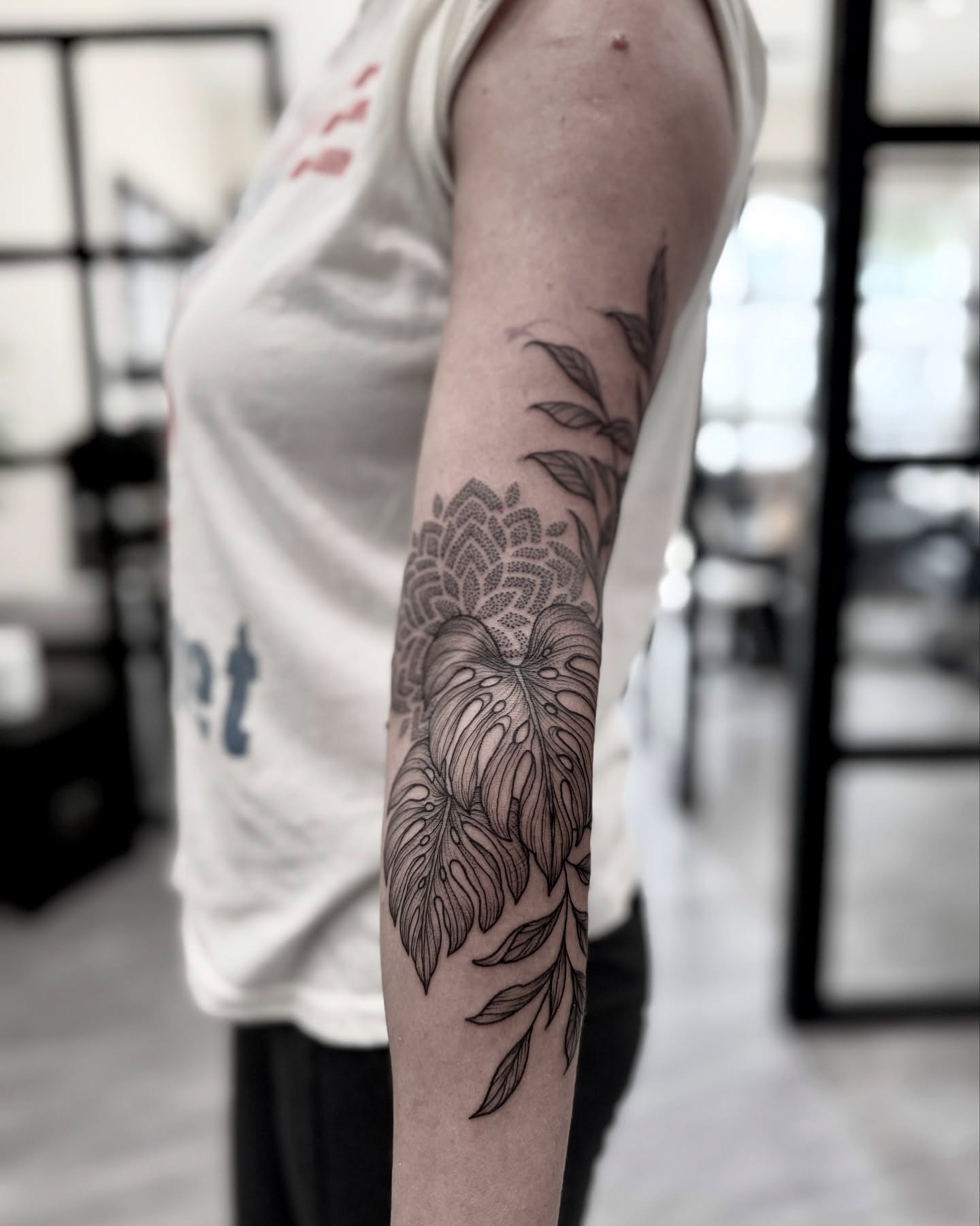 Monstera leaf dotwork tattoo on the forearm by Alex Shakuto Tattoo