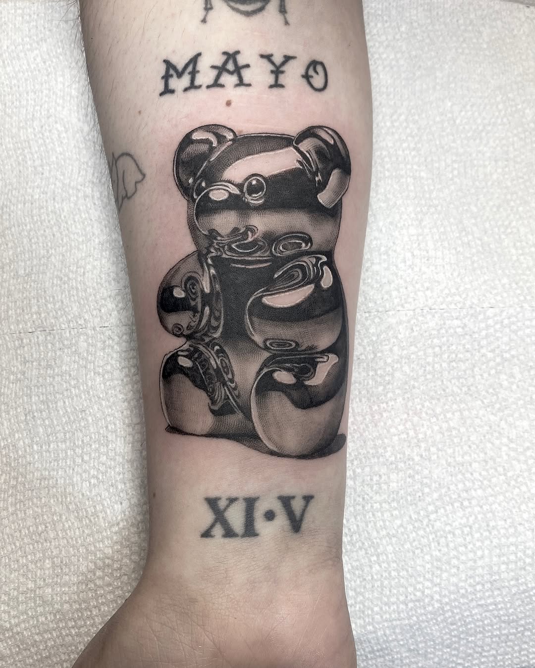 Gummy bear surrealism tattoo on the forearm by <3 eve’s tattoos <3