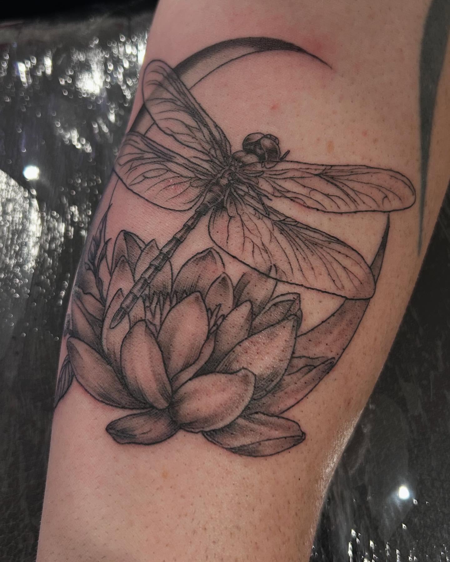 Dragonfly and lotus realism tattoo on the forearm by Jbtattoo Artistry