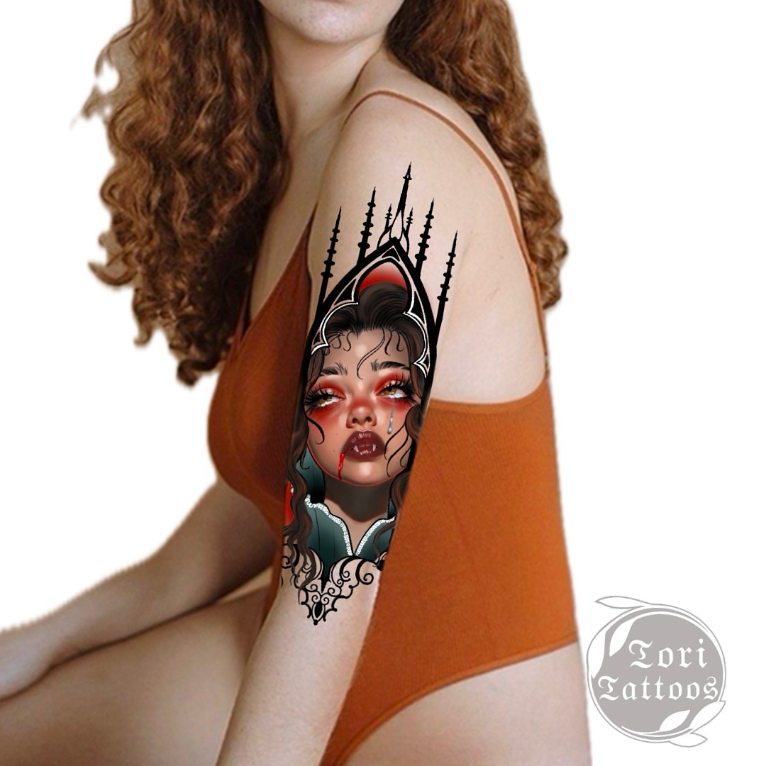 Woman with crown dark realism tattoo on the shoulder by Tori Bent