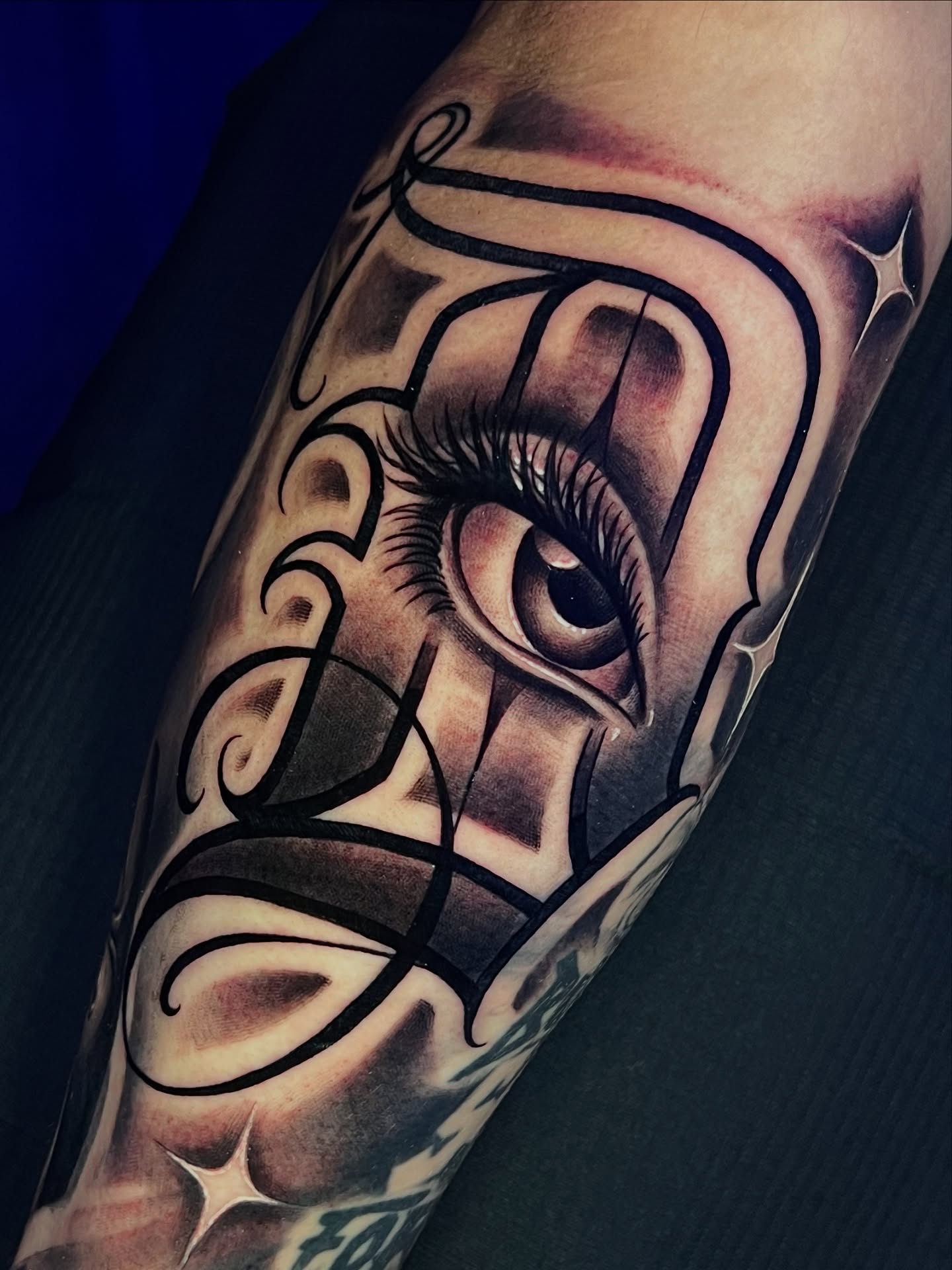 Eye with ornamental design realism tattoo on the forearm by Raw Hound, Hialeah, Florida