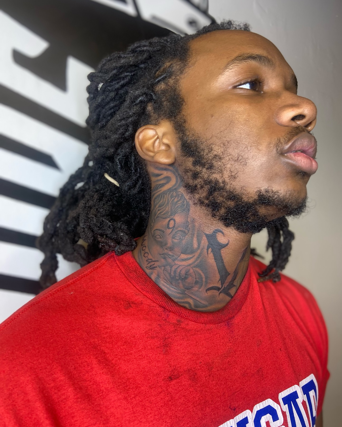Woman's face American traditional tattoo on the neck by Chicago Tattoo Artist