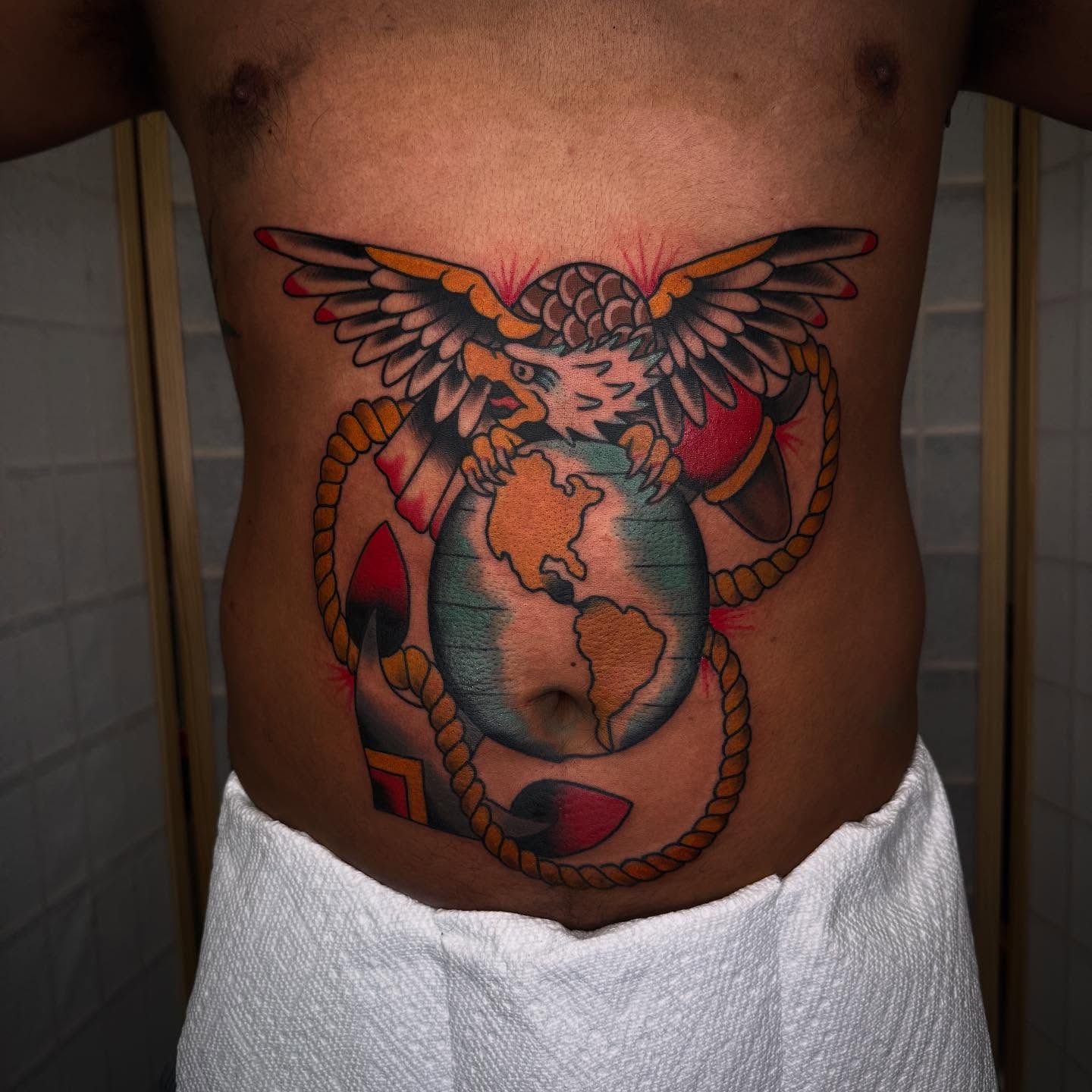 Eagle and globe American traditional tattoo on the ribs by Liz Mercer ★ Tattooer - Raleigh NC