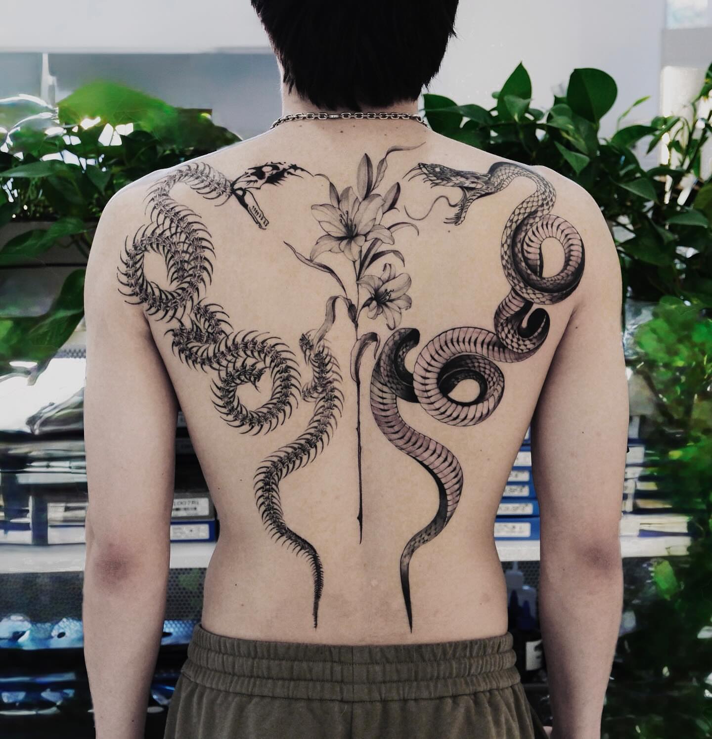 Snakes and flowers black and grey tattoo on the back by MJ tattooist